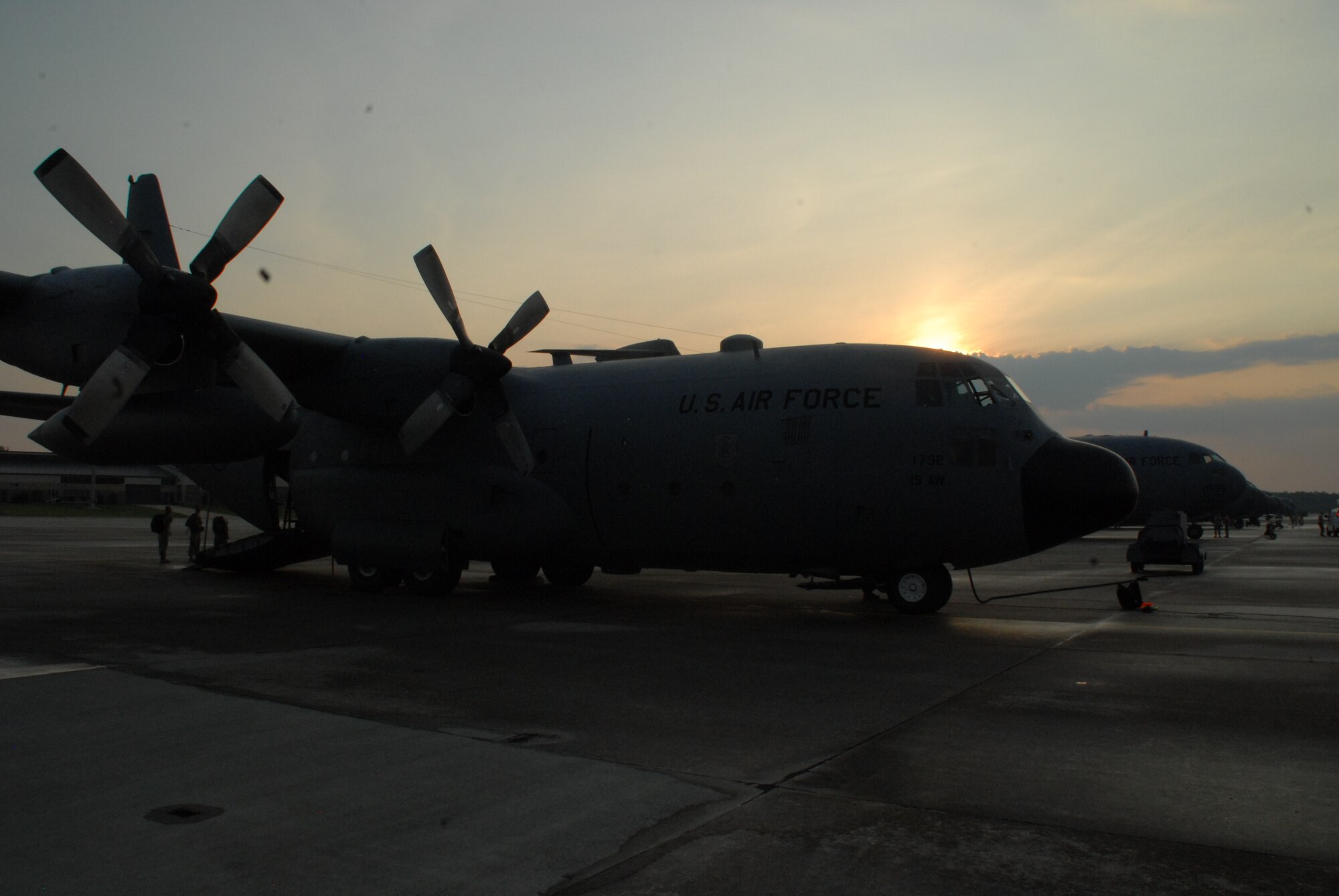 A C-130E from the 53rd Airlift Squadron, Little Rock A.F.B., sits in a long row of C-130s and C-17s June 22 awaiting their first mission in a Joint Forcible Entry Exercise at Pope A.F.B., N.C.  Four crews from Little Rock A.F.B. joined fourteen others from various Air Force Bases to form the largest formation ever assembled for a Joint Forcible Entry Exercise June 22 and 23 at Pope A.F.B. and Fort Bragg, N.C.  (U.S. Air Force photo by Capt. Joe Knable) 