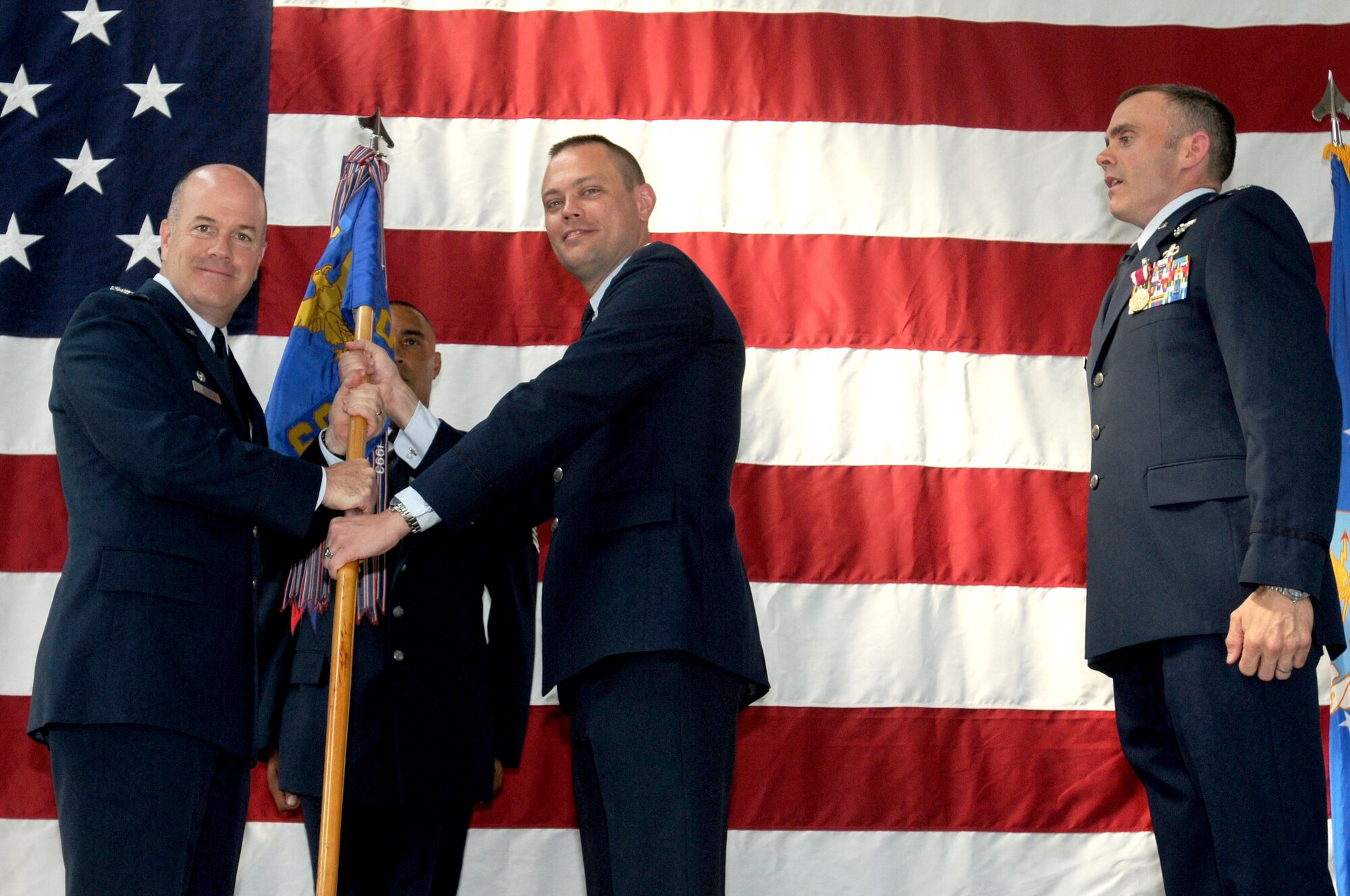 Lt. Col. Jeffrey L. York receives the 603rd Air Control Squadron flag from Col. Patrick J. S. Miller, 31st Operations Group commander, during the squadron's change of command July 9 at the 603rd compound. Colonel York replaced Lt. Col. Matthew T. Smith as the 603rd ACS commander. Colonel Smith will be leaving Aviano and relocating to the Barracks Army War College, Carlisle, Pa. (U.S. Air Force photo/Airman LaVel Sterling)