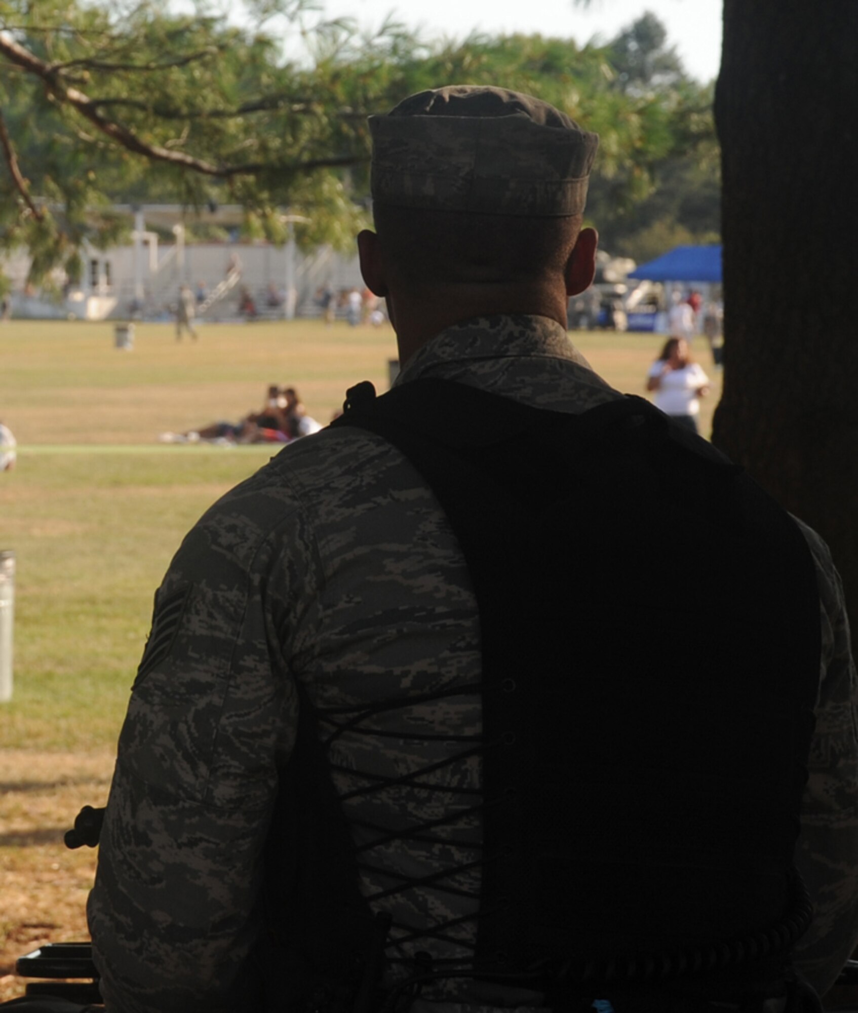 Tech. Sgt. Brad Elkins, 87th Security Forces Squadron, keeps watch for suspicious activity during the Fourth of July celebration at Doughboy Field. More than 20,000 people were present to watch the 30-minute fireworks display tht concluded the evening. (U.S. Air Force photo/ 2nd Lt. Carolyn Glover)