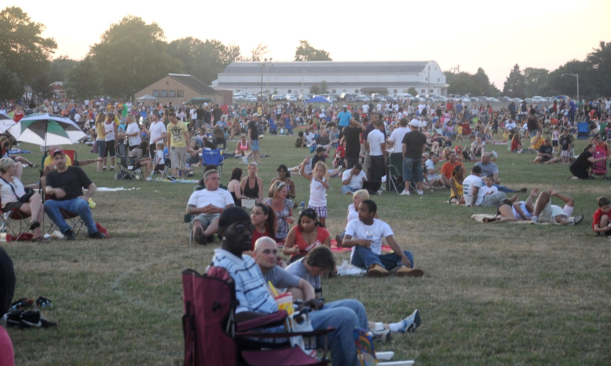 More than 20,000 people attended the Fourth of July celebration at Doughboy Field. The event concluded with a 30-minute fireworks display. The celebration included bouncy castles, a stilt walker, a magician, a balloonist, face painters, live rock-band performances and a fireworks display. (U.S. Air Force photo/Airman 1st Class Bryan Swink)