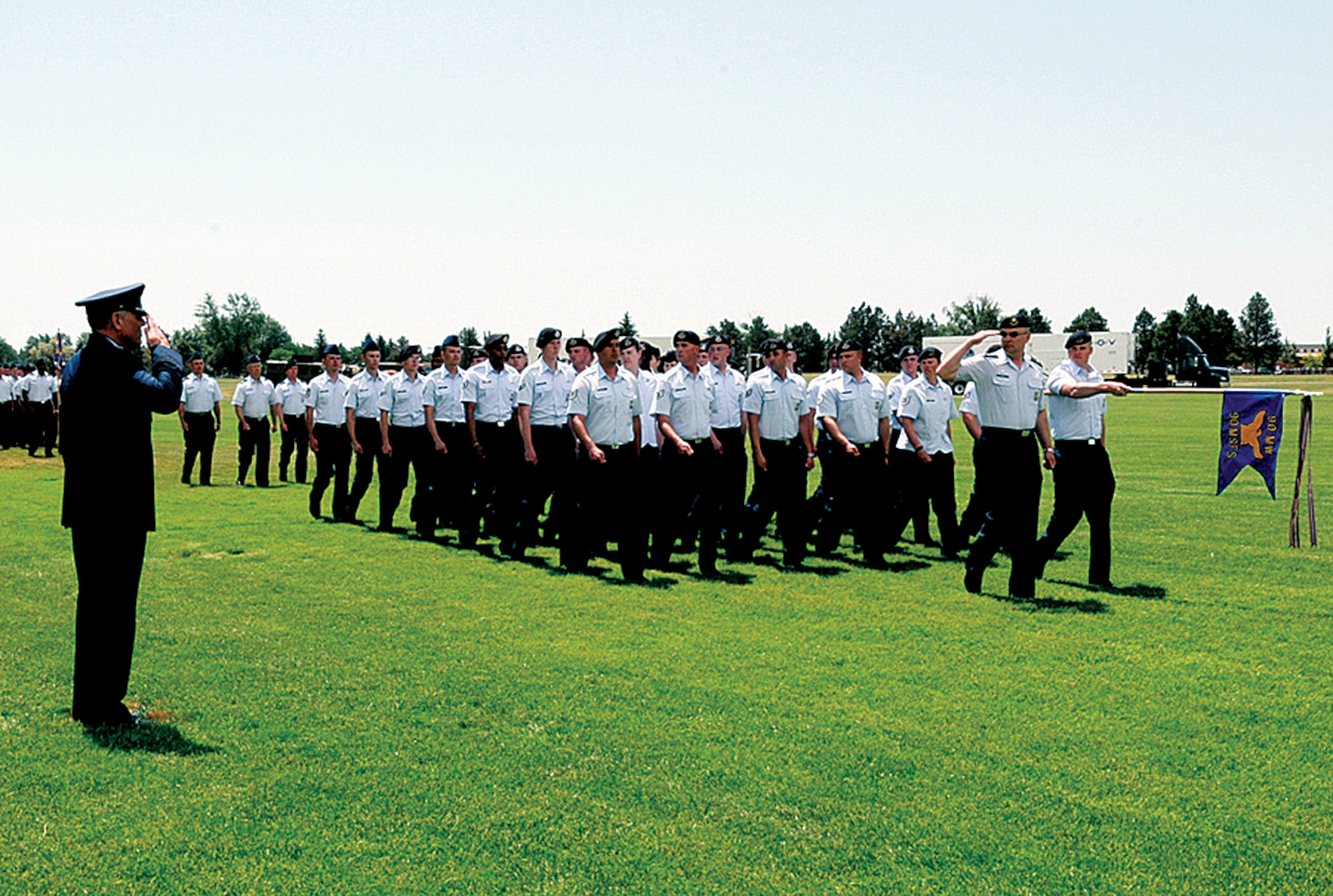 Maj. Gen. C. Donald Alston, 20th Air Force commander, reviews his new command as it passes in review during the change-of-command ceremony held on the Argonne Parade Field on July 1. (U.S. Air Force photo by Gerald Teano)