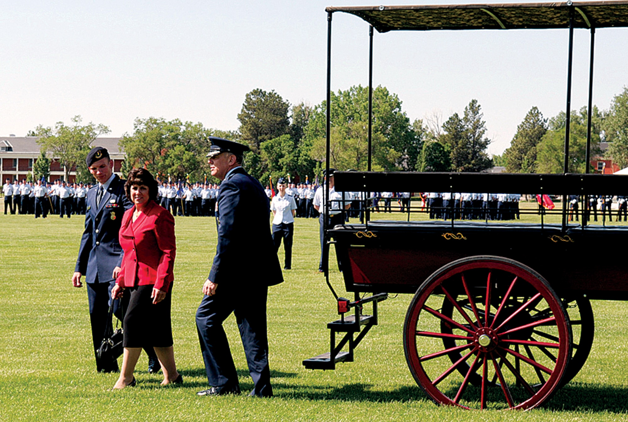 1st Lt. William Gripp, 90th Security Support Squadron, escorts Maj. Gen. and Mrs. C. Donald Alston to their seats for the 20th Air Force change-of-command ceremony. (U.S. Air Force photo by Gerald Teano)
