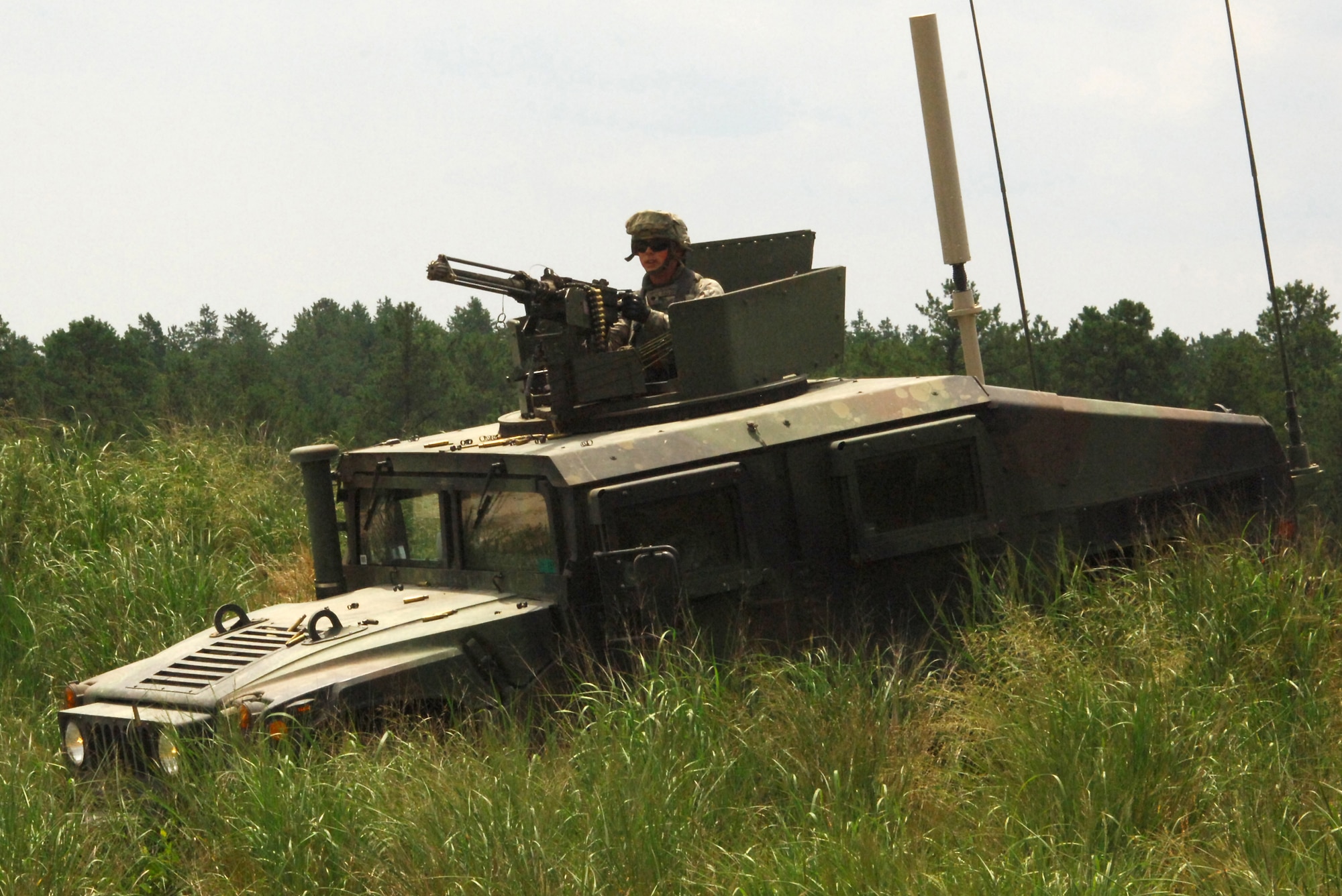 Spc. John Parenteau, responds to enemy fire during a training exercise at Joint Base McGuire-Dix-Lakehurst June 22. His unit, 94th Military Police Company, is an Army Reserve organization from Londonderry, N.H., that is at the joint base preparing for a mission in Iraq where it will train and mentor the Iraq Police force. (U.S. Army photo/Ryan Morton)