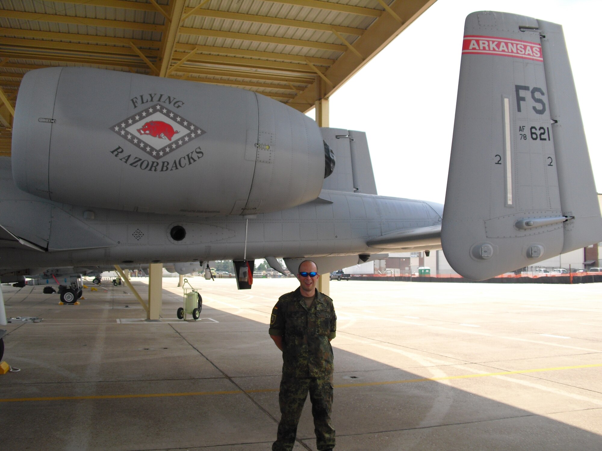 Maj. Jens Cichorek, an Airman in the German Air Force Reserve, poses next to an A-10C Thunderbolt II "Warthog" during a tour of the 188th Fighter Wing's flightline June 17. Cichorek visited the 188th as part of the Reserve Officer Foreign Exchange Program. (U.S. Air Force photo by Capt. Matt Holguin/188th Fighter Wing)
