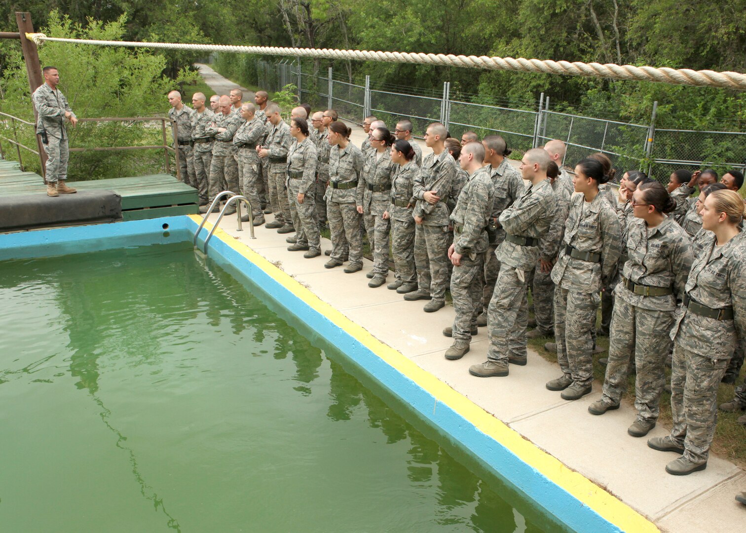 Air Force Basic Military Training trainees are given a safety brief on the proper way to cross obstacles at the BMT obstacle course. The obstacle course is completing during the fourth week of BMT. (U.S. Air Force photo/Robbin Cresswell)