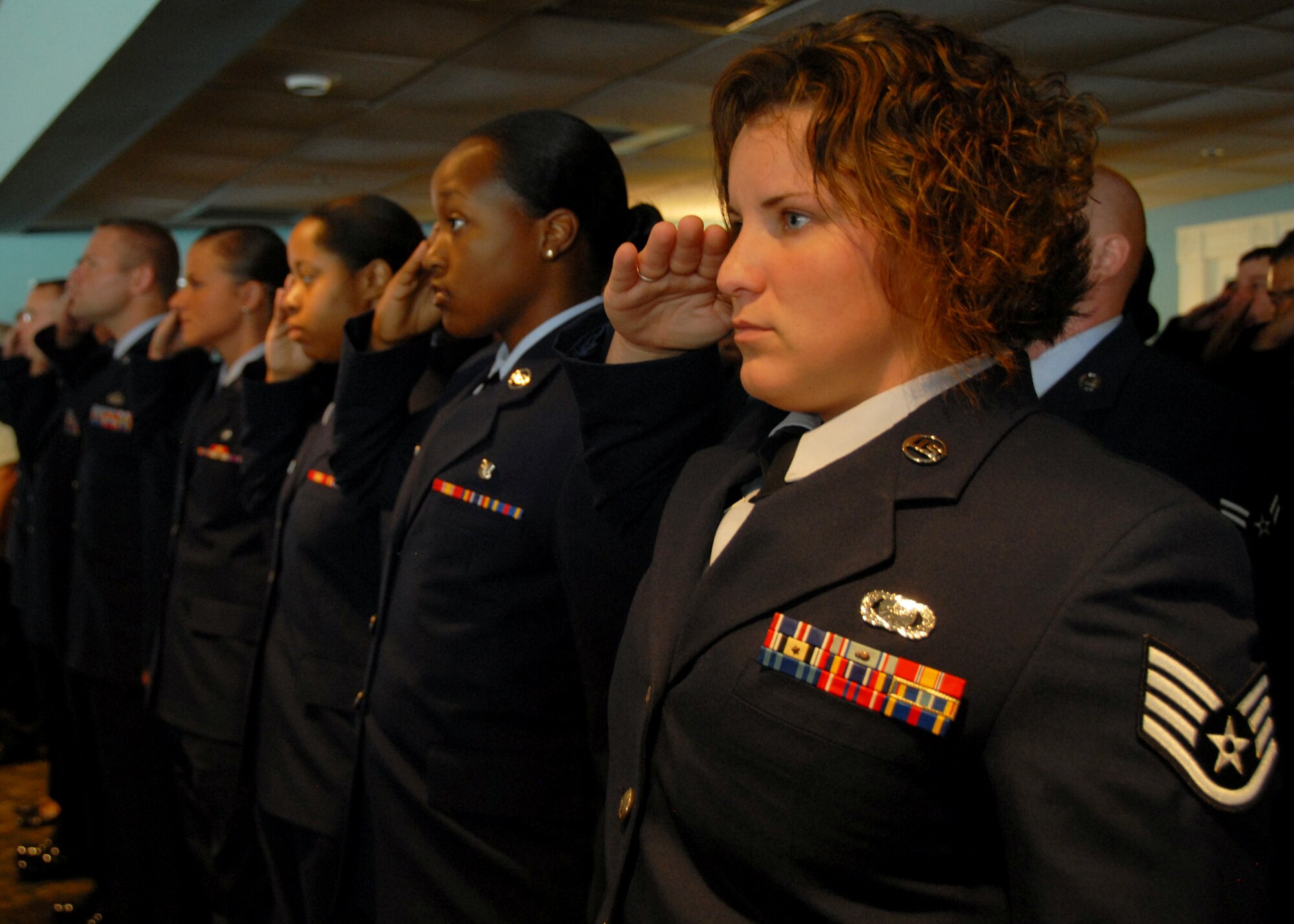 Members of the 96th Air Base Wing staff formation salute during the national anthem at the 96th Air Base Wing change of command July 8 at the officers club.  Col. Sal Nodjomian took command of the wing from departing commander, Col. Bruce McClintock.  (U.S. Air Force photo/Samuel King Jr.)