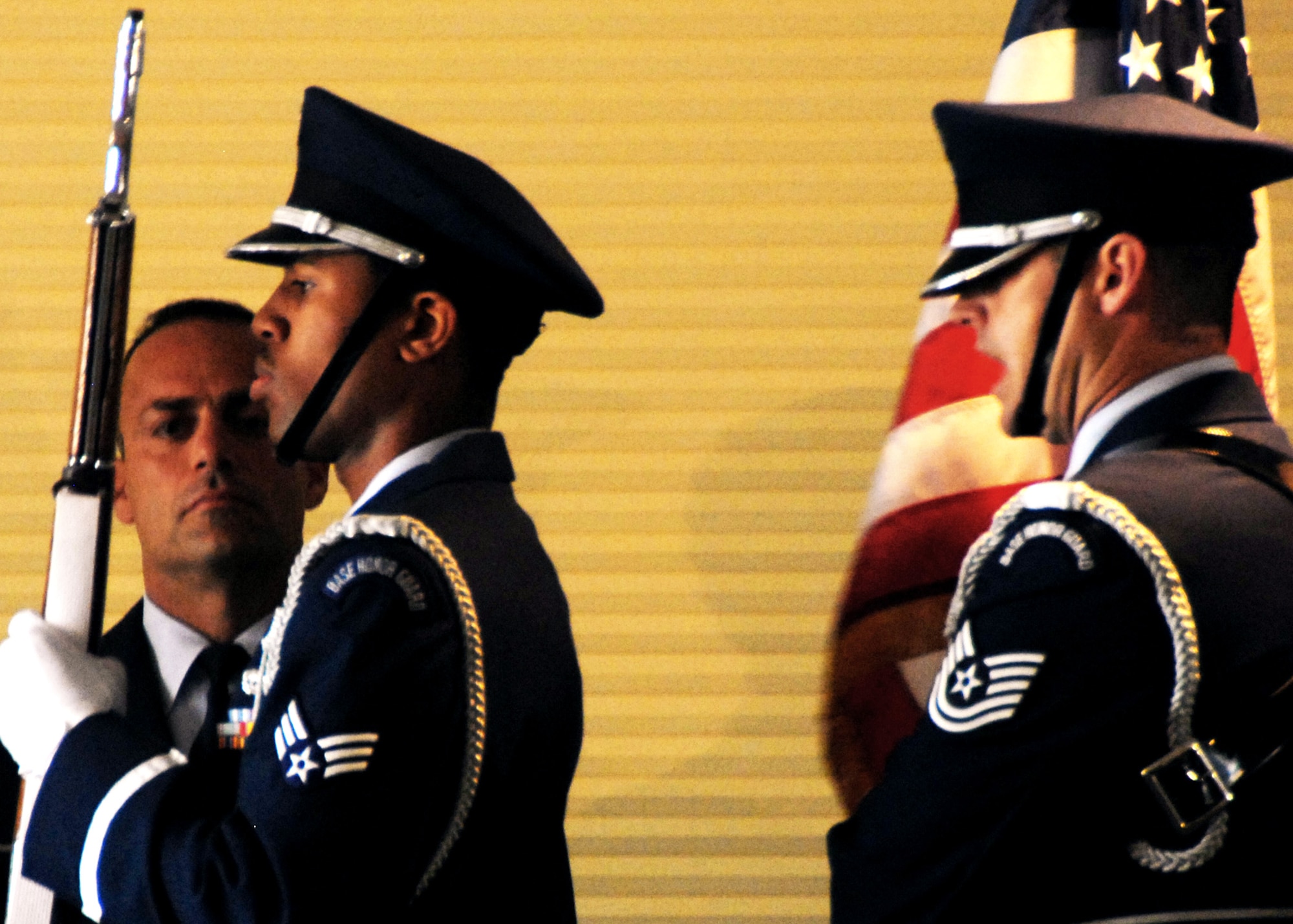 Colonel Sal Nodjomian watches as the Eglin Honor Guard prepare to post the colors during the 96th Air Base Wing change of command July 8 at the officers club.   Colonel Nodjomian and his family arrive to Eglin Air Force Base, Fla., from Washington, D.C., where he was the Senior Military Assistant, Assistant Secretary of the Air Force, Installations, Environment and Logistics.  (U.S. Air Force photo/Samuel King Jr.)