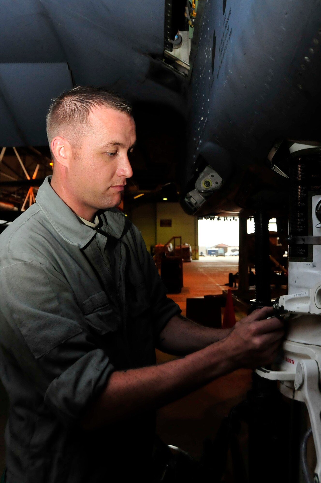 Staff Sgt. Heath McGoldrick, 48th Equipment Maintenance Squadron repair and reclamation craftsman, conducts an inspection on an F15 Strike Eagle at hangar 7 at RAF Lakenheath, England July 8. Sergeant McGoldrick was nominated for a Liberty Spotlight because he displays the core value of 'Excellence in All We Do'. (U.S. Air Force photo/Airman 1st Class Eboni Knox) 