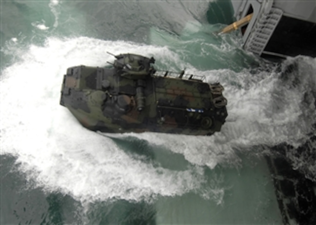 A U.S. Marine Corps amphibious assault vehicle launches from the well deck of the amphibious assault ship USS Boxer (LHD 4) in the Pacific Ocean on July 7, 2010.  Amphibious assault vehicles from Camp Pendleton, Calif., were brought on board for well deck certification exercises as the ship conducts operations off the coast of southern California.  