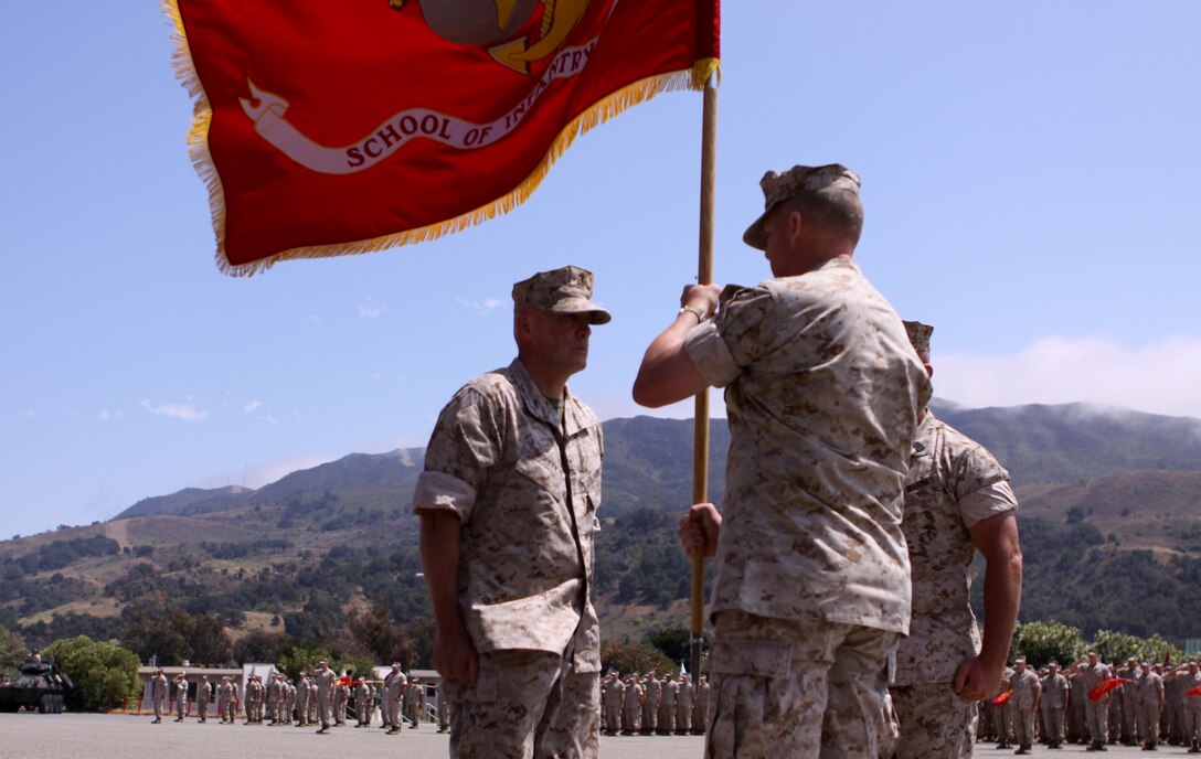 Colonel Kevin T. Wooley (left), takes command of School of Infantry West, from Col. Brennan T. Byrne, July 9. Before taking over command for SOI-W, Wooley transferred to Marine Special Operations Command where he served as the assistant chief of staff for operations. Byrne will be transferring to I Marine Expeditionary Force where he will serve as the deputy assistant chief of staff for operations.