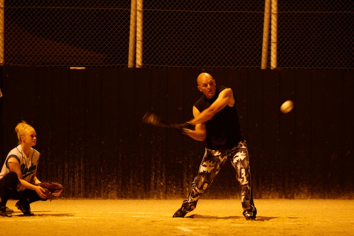 Team Torii first baseman, Chad Roach, unleashes his anger for work on the slow-pitched softball for an in-the-park home run during the first inning of play against Sasquatch and the Dislexic Abominable Rastas at the main softball field here July 9. With a 13-11 loss, Sasquatch and the Dislexic Abominable Rastas dropped to a season record of 2-6 while Team Torii remains undefeated.