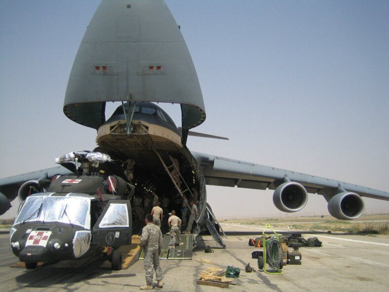 Dover Air Force Base Reserve and active-duty C-5 aircrews from the 709th and 9th Airlift Squadrons spent June 15 to July 15 overseas supporting the troop surge by delivering 4 million pounds of cargo to various locations in Afghanistan. (U.S. Air Force photo)