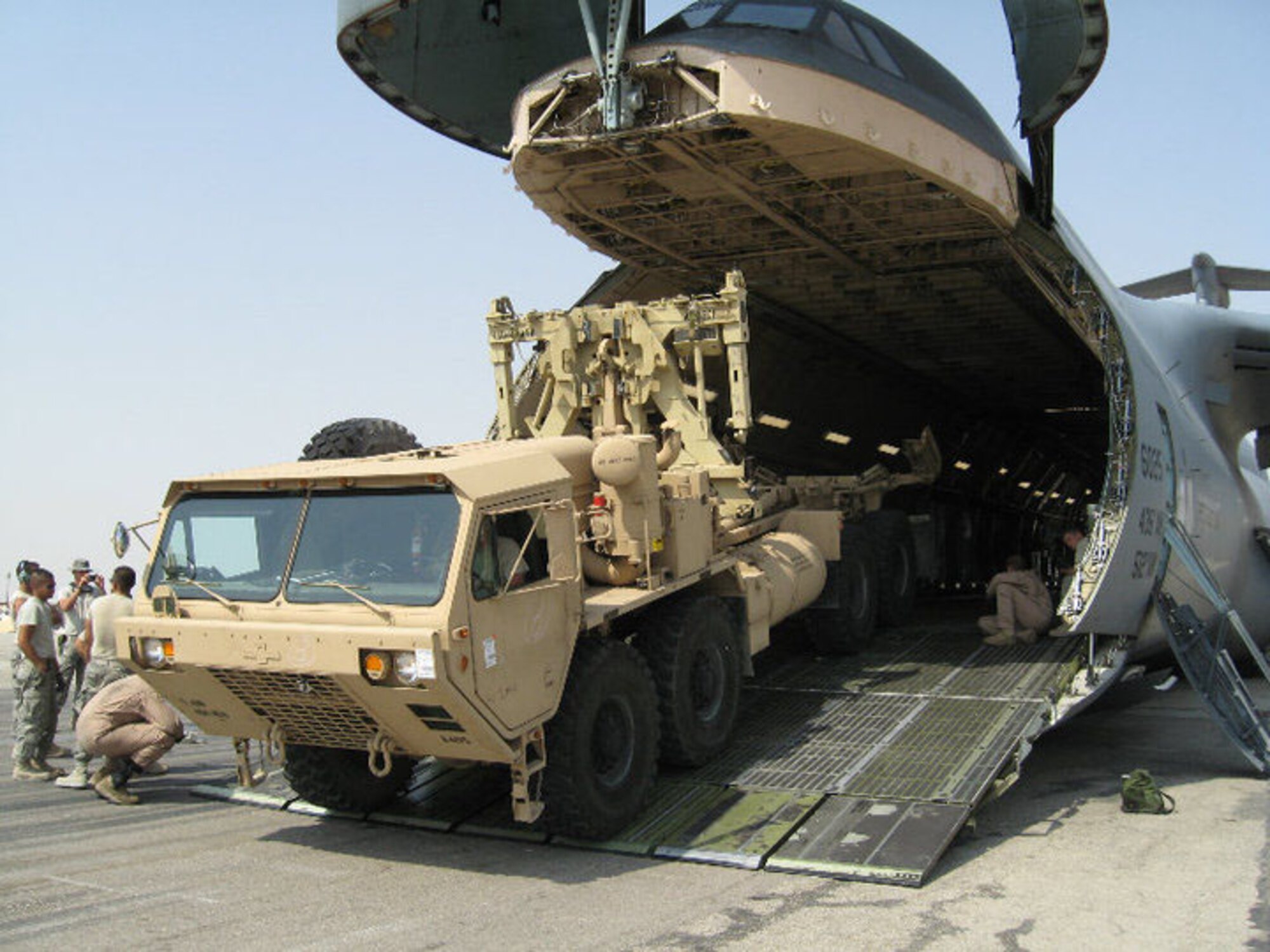 Dover Air Force Base Reserve and active-duty C-5 aircrews spent June 15 to July 15 overseas supporting the Afghanistan troop surge by delivering 4 million pounds of cargo to various locations in Afghanistan. (U.S. Air Force photo)