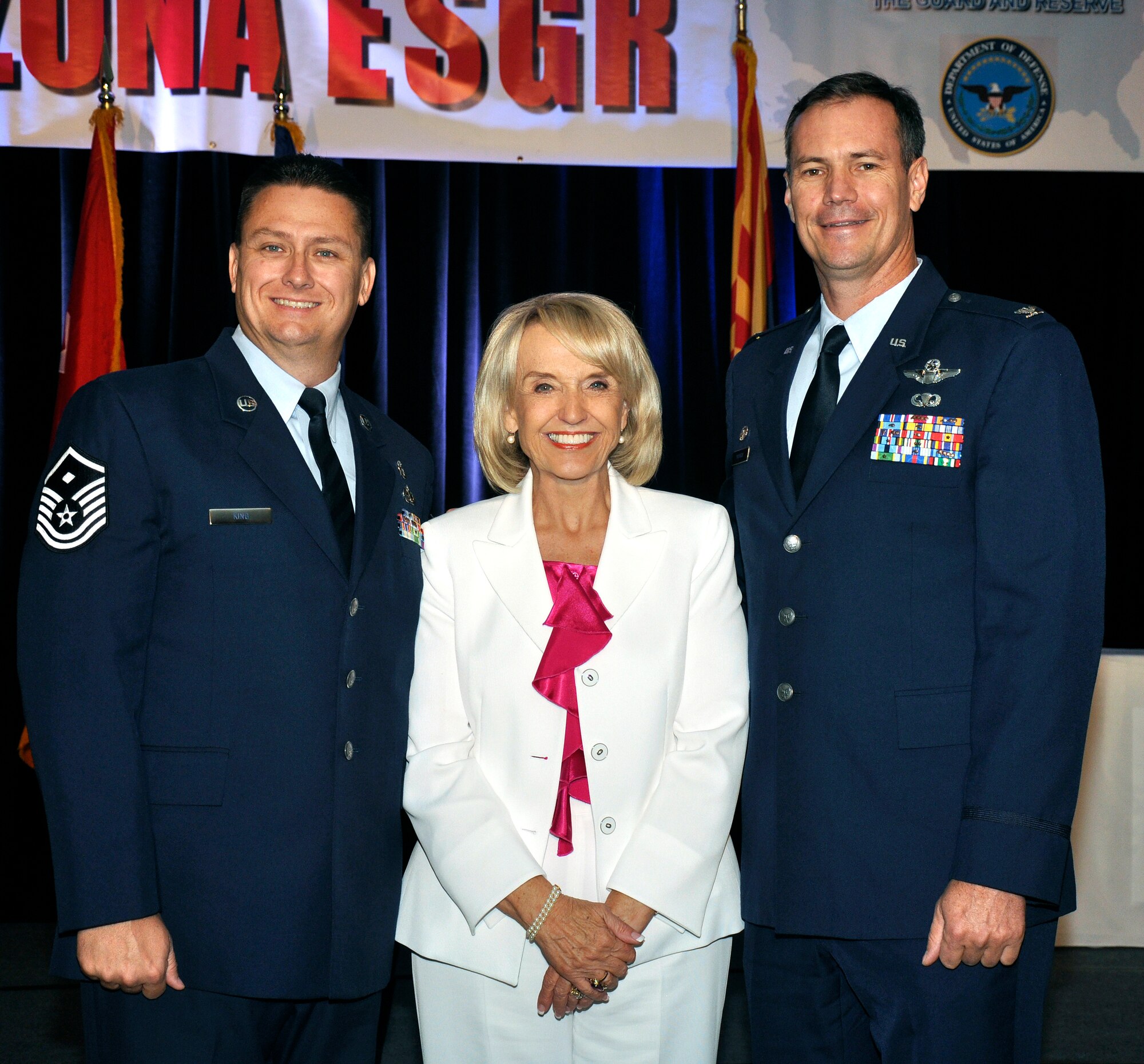 Master Sgt. James King, 944th Logistics Readiness Squadron first sergeant, and Col. Michael Popovich, 944th Fighter Wing commander, pose with Arizona Governor Jan Brewer at an Employer Support of the Guard and Reserve luncheon June 29 that recognized civilian employers of Guard and Reserve personnel. Sergeant King's employer, American Express, has support him while serving on active duty orders with the 56th Security Forces Squadron. (Courtesy photo)