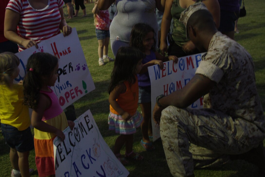 MARINE CORPS AIR GROUND COMBAT CENTER TWENTYNINE PALMS, Calif.--Corporal Cory Tribble is greeted by family and friends upon his return with the Battalion Landing Team 2nd Battalion 7th Marine Regiment at from the 31st Marine Expeditionary Unit Sunday at Del Valle softball field.