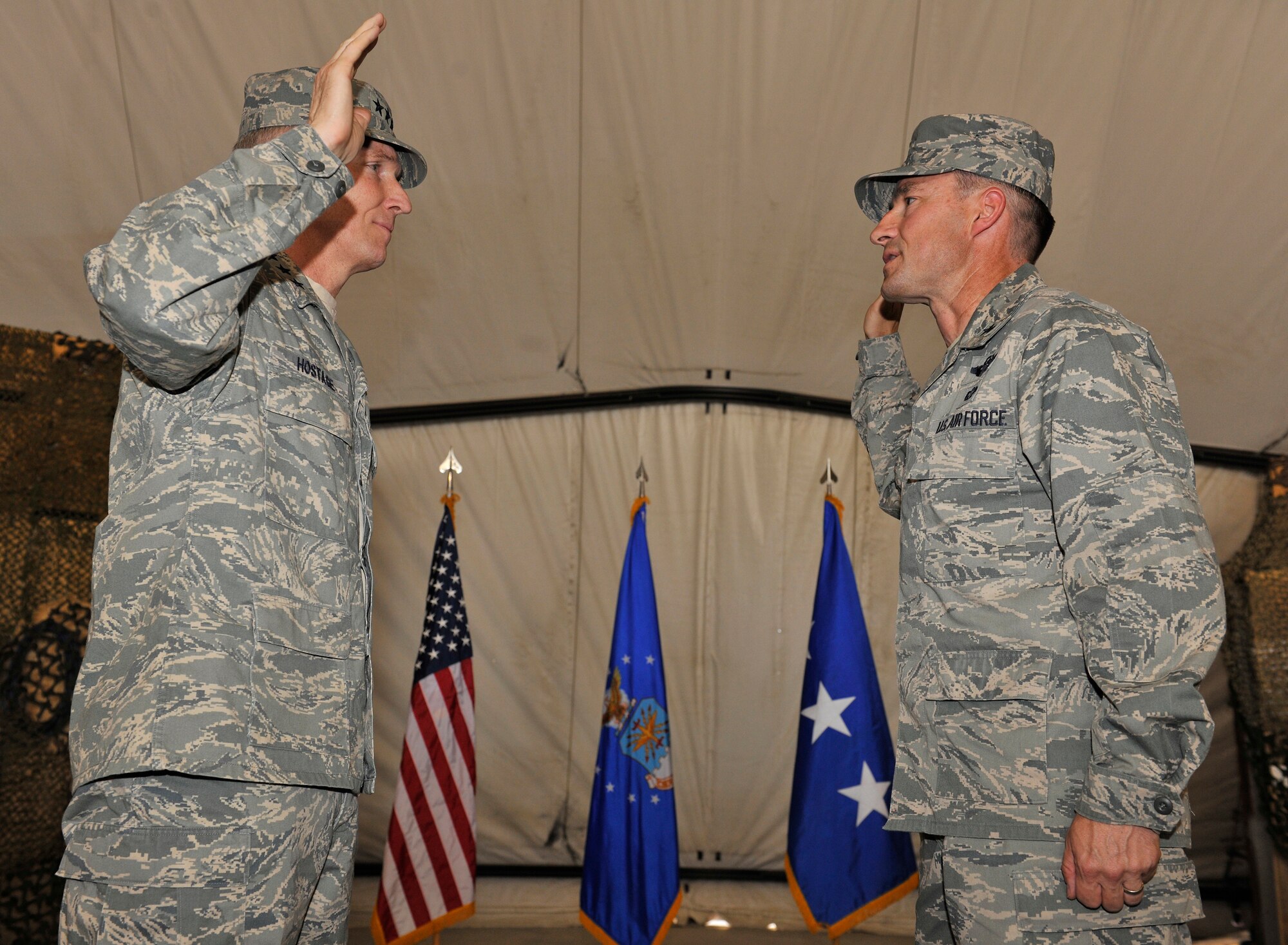 Lt. Gen. Mike Hostage, Commander, U.S. Air Forces Central Command, reads the oath of office to Brig. Gen Jack Briggs', Commander, 455th Air Expeditionary Wing. Brig. Gen. Briggs' promotion ceremony was held at Bagram Airfield, Afghanistan, July 10, 2010. (U.S. Air Force photo/Staff Sgt. Christopher Boitz)