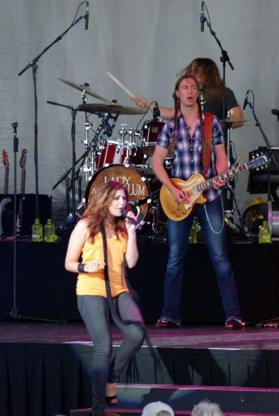 Country singer, Tim McGraw, partnered with the Air Force Reserve recruiting service to host a special event for Air Force Reservists and potential servicemembers July 10 at Jiffy Lube Live in Bristow, Va. The Reserve recruiting team, in conjunction with Blaine Warren Advertising, offered the "Get 1 Now - Refer a Friend Tour."  Several members of the 459th Air Refueling Wing attended a pre-concert event with Tim McGraw. Photo features band "Lady Antebellum," which sang before Tim McGraw. The concert was attended by approximately 20,000. (U.S. Air Force photo/Capt. Rebecca A. Garcia)