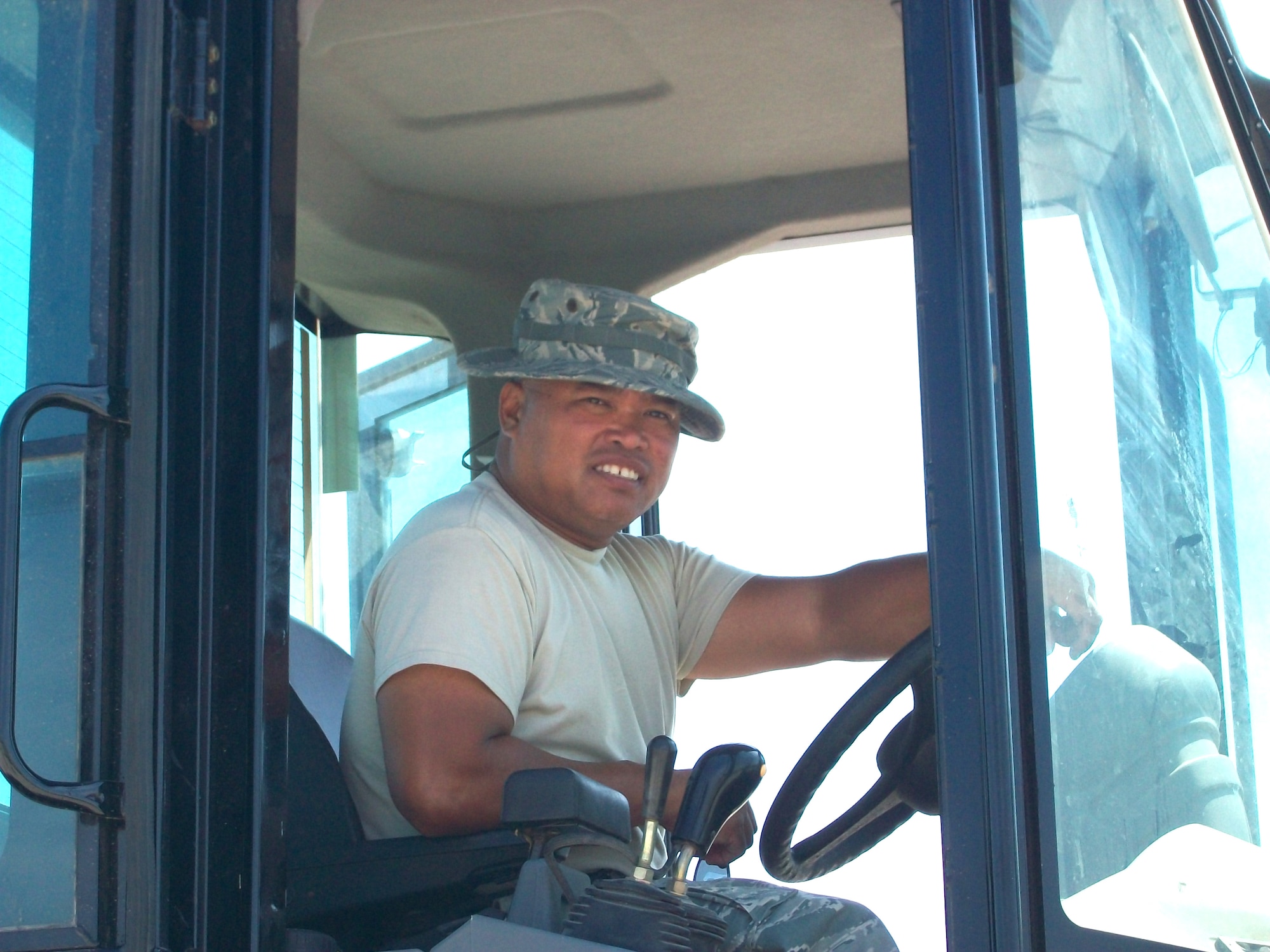 JOINT BASE LEWIS-MCCHORD, Wash. -- Master Sgt. Rodney Fernandez, 86th Aerial Port Squadron's security manager, operates a 10K All Terrain Forklift at Toussaint Louverture International Airport in Port-au-Prince, Haiti.  Sergeant Fernandez supported the movement of more than 1,000,000 pounds of military assets during his deployment. 
