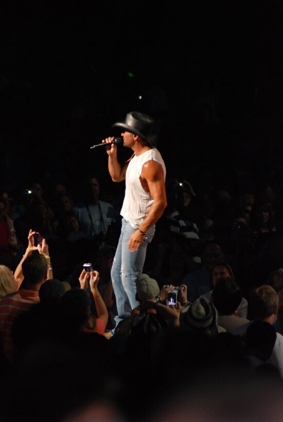 Country singer, Tim McGraw, partnered with the Air Force Reserve recruiting service to host a special event for Air Force Reservists and potential servicemembers July 10 at Jiffy Lube Live in Bristow, Va. The Reserve recruiting team, in conjunction with Blaine Warren Advertising, offered the "Get 1 Now - Refer a Friend Tour."  Several members of the 459th Air Refueling Wing attended a pre-concert event with Tim McGraw where he sang and signed autographs. By referring a friend, members received a pre-concert party pass and two tickets to the concert, which was attended by approximately 20,000. (U.S. Air Force photo/Capt. Rebecca A. Garcia)