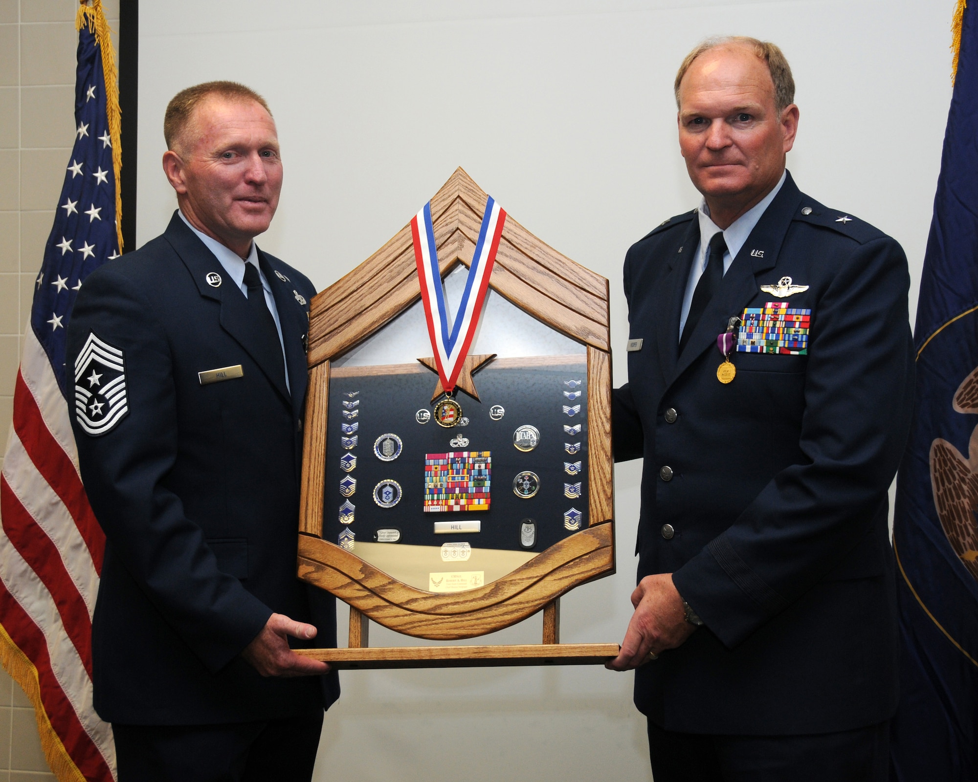 A retirement ceremony was held on the Utah Air National Guard base for General David M. Hooper and Chief Robert A. Hill July 10. General David M. Hooper and Chief Robert A. Hill both served in the military for 32 years.  (U.S. Air Force photo by Staff Sgt. Emily Monson)	