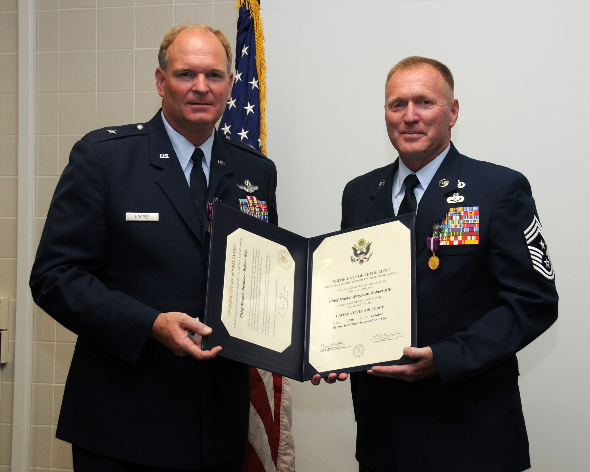 A retirement ceremony was held on the Utah Air National Guard base for General David M. Hooper and Chief Robert A. Hill July 10. General David M. Hooper and Chief Robert A. Hill both served in the military for 32 years.  (U.S. Air Force photo by Staff Sgt. Emily Monson)	