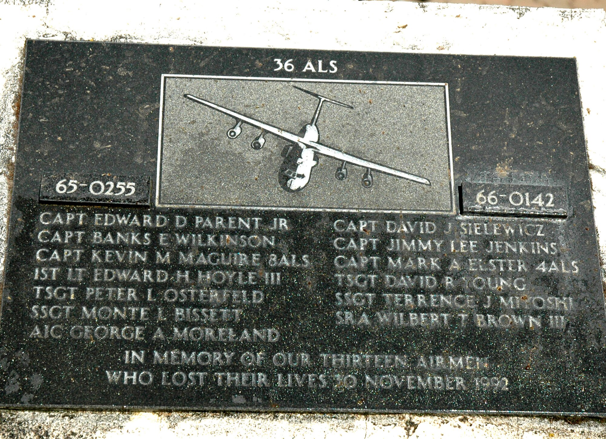 JOINT BASE LEWIS-MCCHORD, Wash. - The names of the 13 Airmen from McChord Field who died during a routine refueling flight over Montana in Nov. 1992, are etched out for all to see and remember. Reservists with 446th Aircraft Maintenance Squadron here cleaned up the memorial site and the plaque, July 10, to honor the McChord 13. (U.S. Air Force Photo/Staff Sgt. Nicole Celestine)