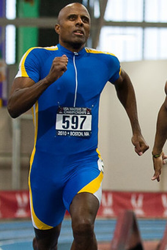 BOSTON -- Track runner and U.S. Air Force Tech. Sgt. Khalid Mulazim, a budget noncomissioned officer with the 910th Airlift Wing at Youngstown Air Reserve Station, Ohio, rounds the corner of the indoor track here during the 400-meter race here. Sergeant Mulazim, 44, began competing in track and field events in 2002. (courtesy photo) 