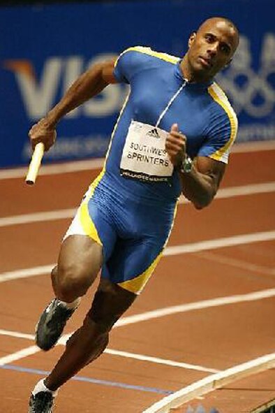 NEW YORK -- Track runner and U.S. Air Force Tech. Sgt. Khalid Mulazim, a budget noncomissioned officer with the 910th Airlift Wing at Youngstown Air Reserve Station, Ohio, rounds the corner of the indoor track here during the 4x400-meter race of the 2009 Millwood Games held at Madison Square Garden here, Jan.30, 2009. Sergeant Mulazim, 44, began competing in track and field events in 2002. (courtesy photo) 