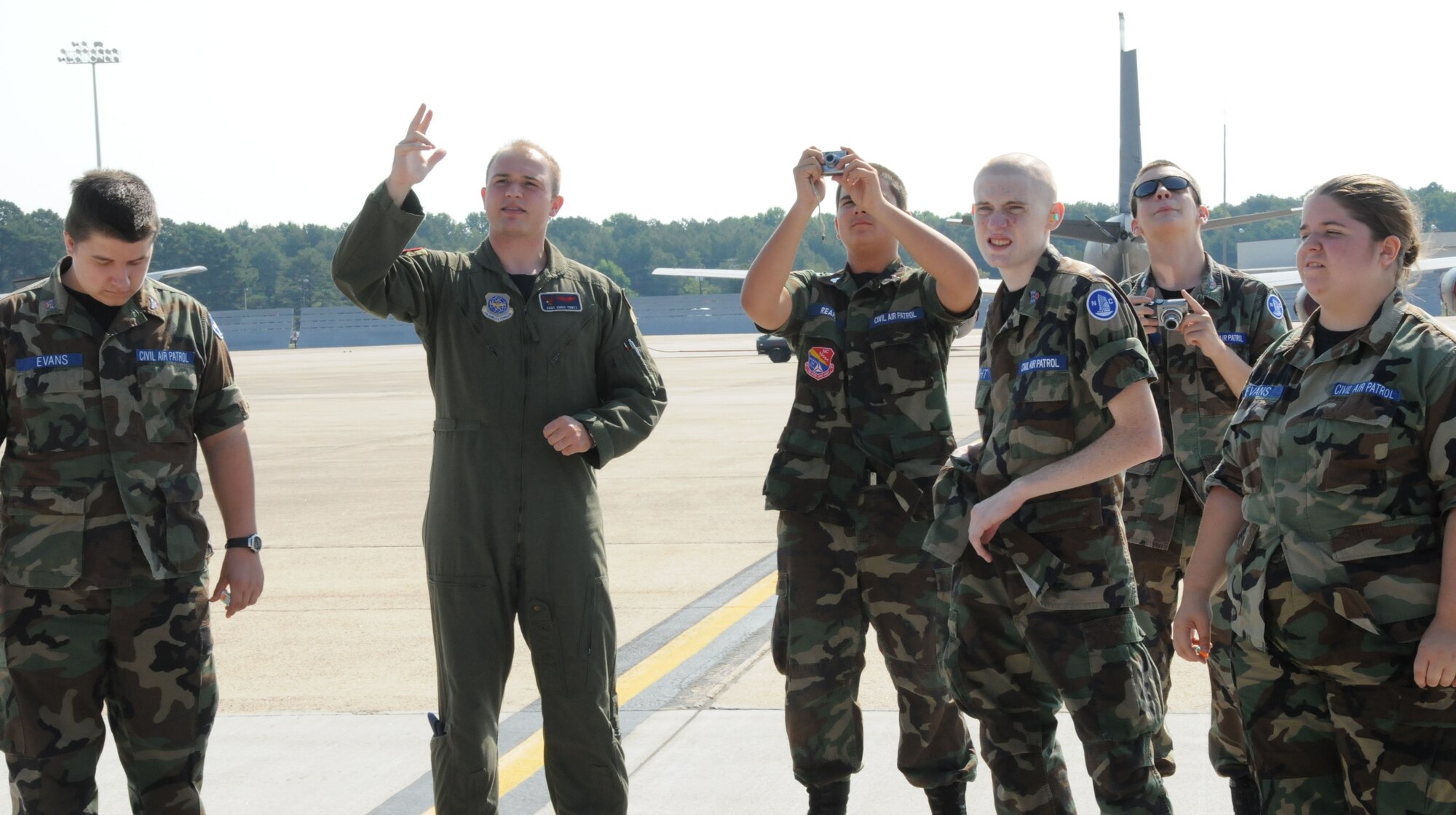 Staff Sgt. Christopher Yontz explains to the Tar River Civil Air Patrol cadets some of the mechanics of the KC-135 Stratotanker before boarding the plane for an orientation flight.(USAF photo by SSgt. Terrica Y. Jones 916 ARW/PA)