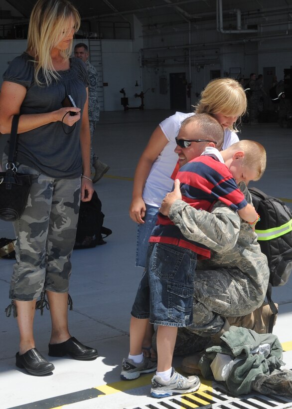 459th Air Refueling Wing Airmen returning from a deployment to Southwest Asia enjoy time with family, here July 3. (U.S. Air Force photo/Staff Sgt. Melissa Stonecipher)