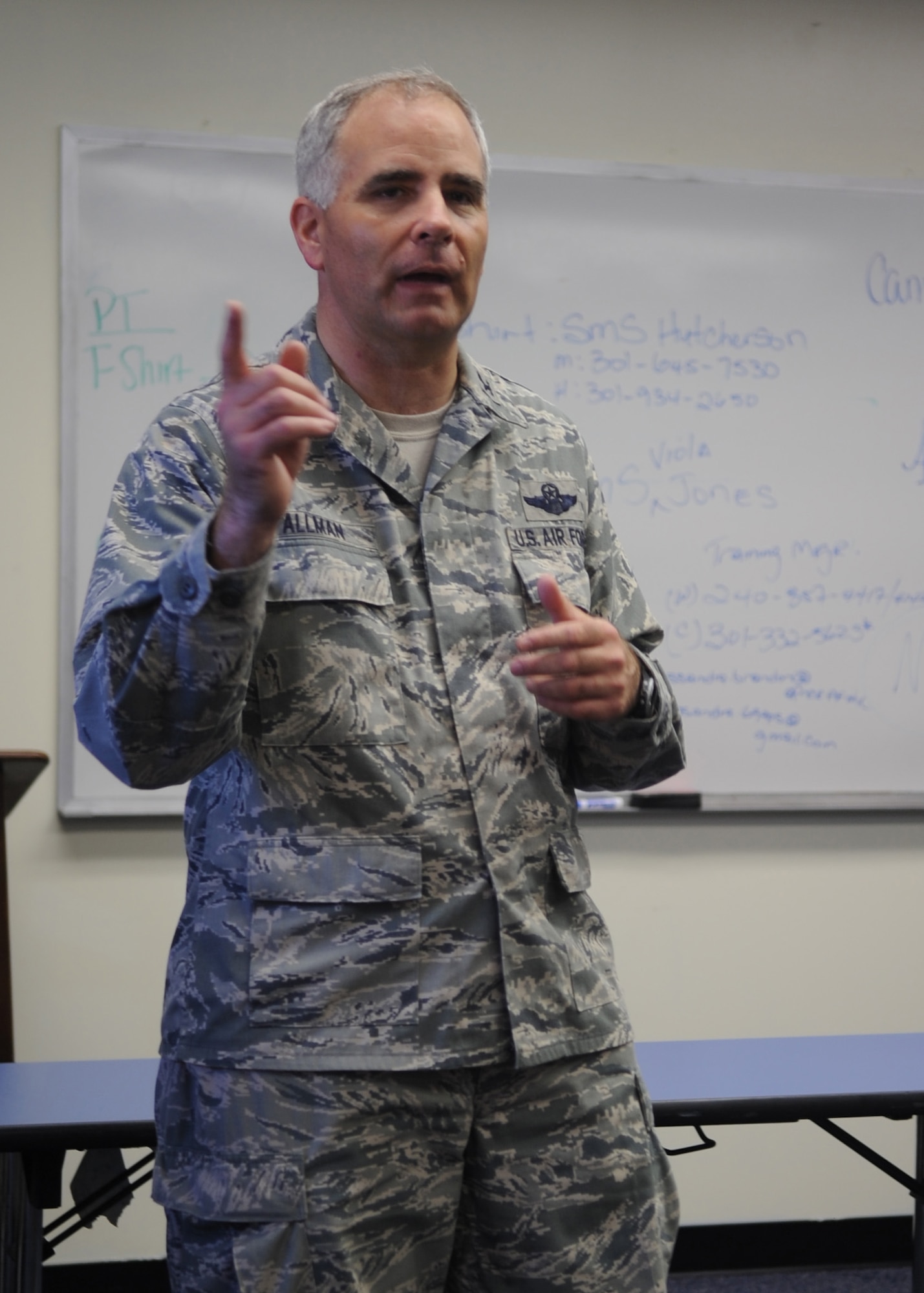 Col. James M. Allman, 459th Air Refueling Wing commander, briefs 459th ARW Airmen about re-deployment responsibilities after returning from Southwest Asia, here July 3. (U.S. Air Force photo/Staff Sgt. Melissa Stonecipher)
