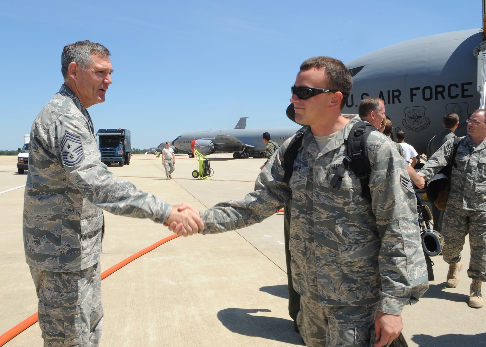 459th Air Refueling Wing Comand Chief Master Sgt. Clifford Van Yahres welcomes Airmen from the 459th ARW after returning from a deployment to Southwest Asia, here July 3. (U.S. Air Force photo/Staff Sgt. Melissa Stonecipher)
