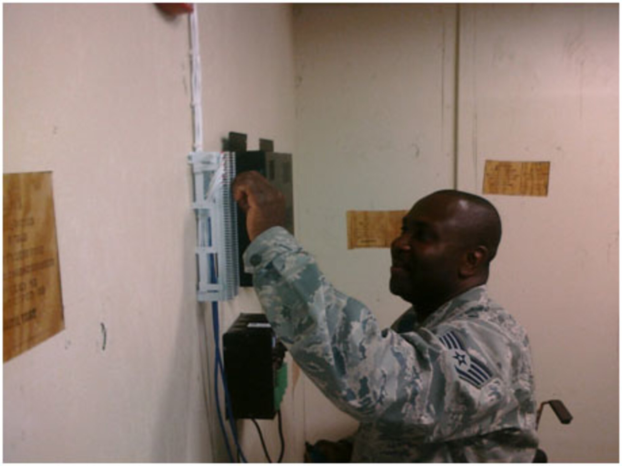 Staff Sergeant Roger Foreman installs an intercom system during his annual tour at MacDill Air Force Base, Fla. Sgt. Foreman is a Reservist with the 916th Communication Squadron. (USAF photo by TSgt. Michael Burbank, 916CS)
