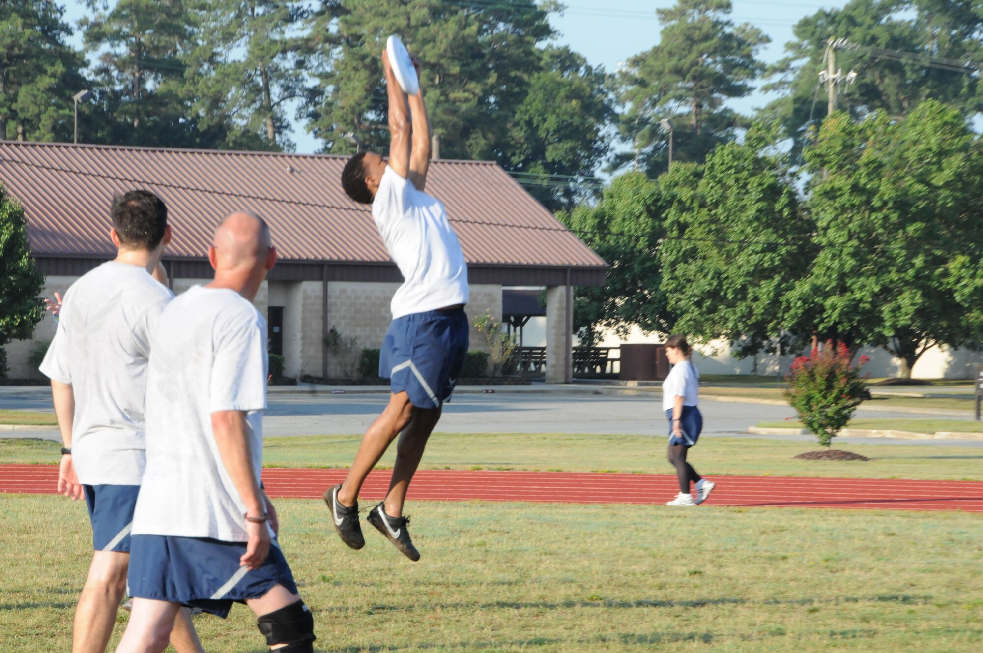Capt. Stephen Stokes, Wing Equal Opportunity, goes high to catch the frisbee during a wing staff game of ultimate frisbee during the July drill weekend. (USAF photo by 916ARW/PA)