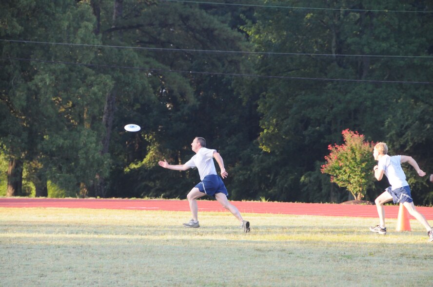 Lt. Col. Matt Young, Wing Safety, tries to catch Lt. Col. Bob Youngblood, Staff Judge Advocate during a game of ultimate frisbee. (USAF photo by 916ARW/PA)