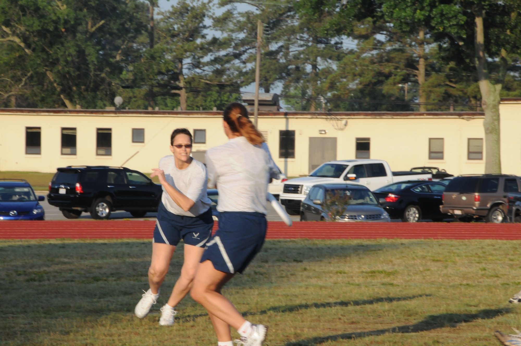 Maj. Shelley LeVan, Wing Equal Opportunity, charges Maj. Shannon Mann, Wing Public Affairs during a game of ultimate frisbee. (USAF photo by 916ARW/PA)