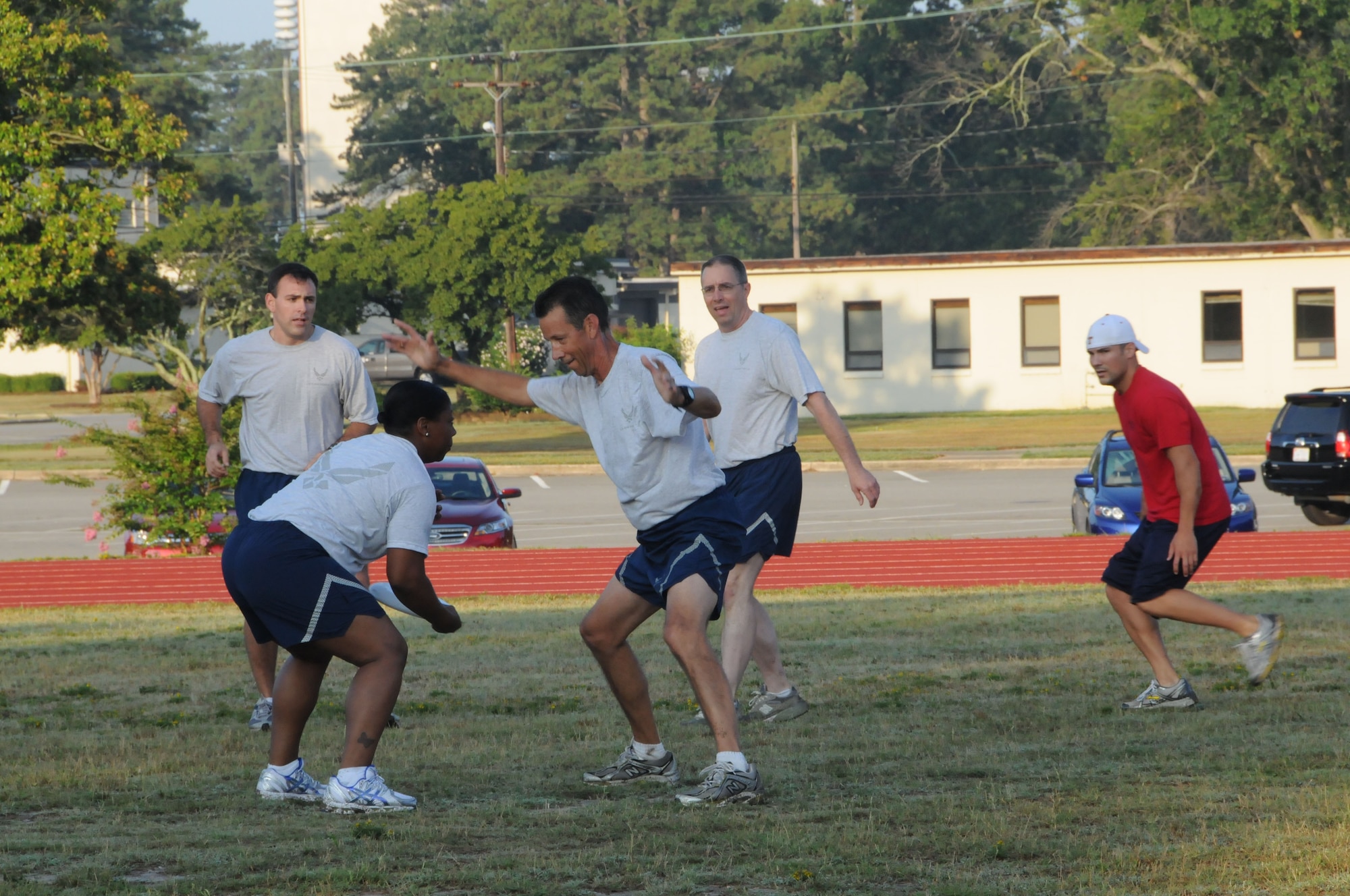 Staff Sgt. Terrica Jones, Wing Public Affairs, tries to get the frisbee by Lt. Col. Gary Wilson, Wing Inspector General, as Capt. Barry Crosby, Wing exec officer, Lt. Col. Bob Youngblood, staff judge advocate and Staff Sgt. Sean Gilson, 911th boom, look open. (916ARW/PA)