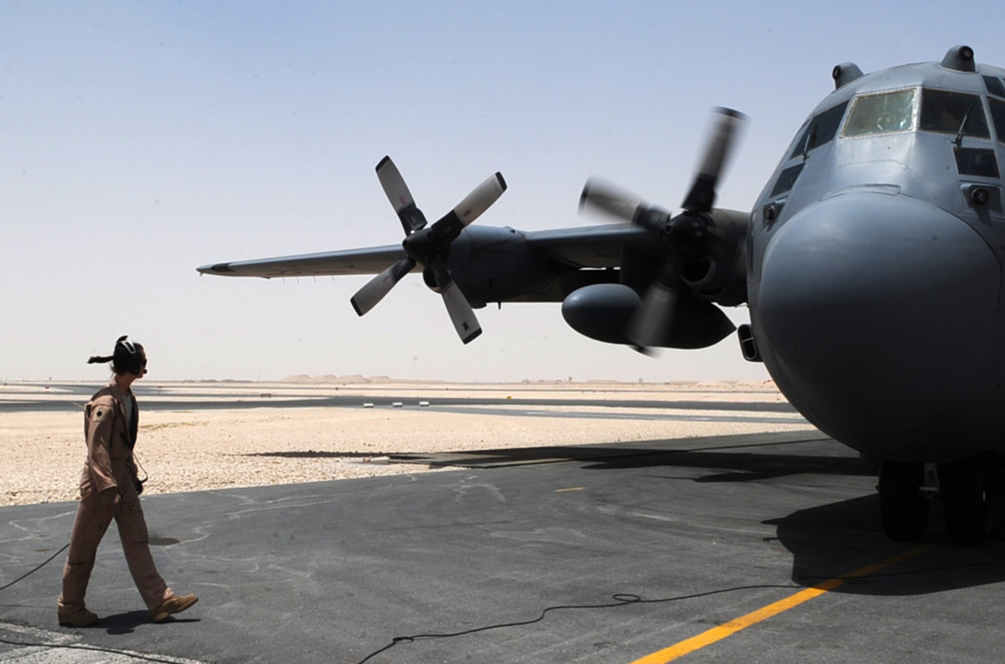 Master Sgt. Cassandra Satterwhite, 746th Expeditionary Airlift Squadron loadmaster, performs a preflight inspection of a C-130 Hercules at an undisclosed location in Southwest Asia June 23, 2010. (U.S. Air Force photo/Senior Airman Kasey Zickmund)