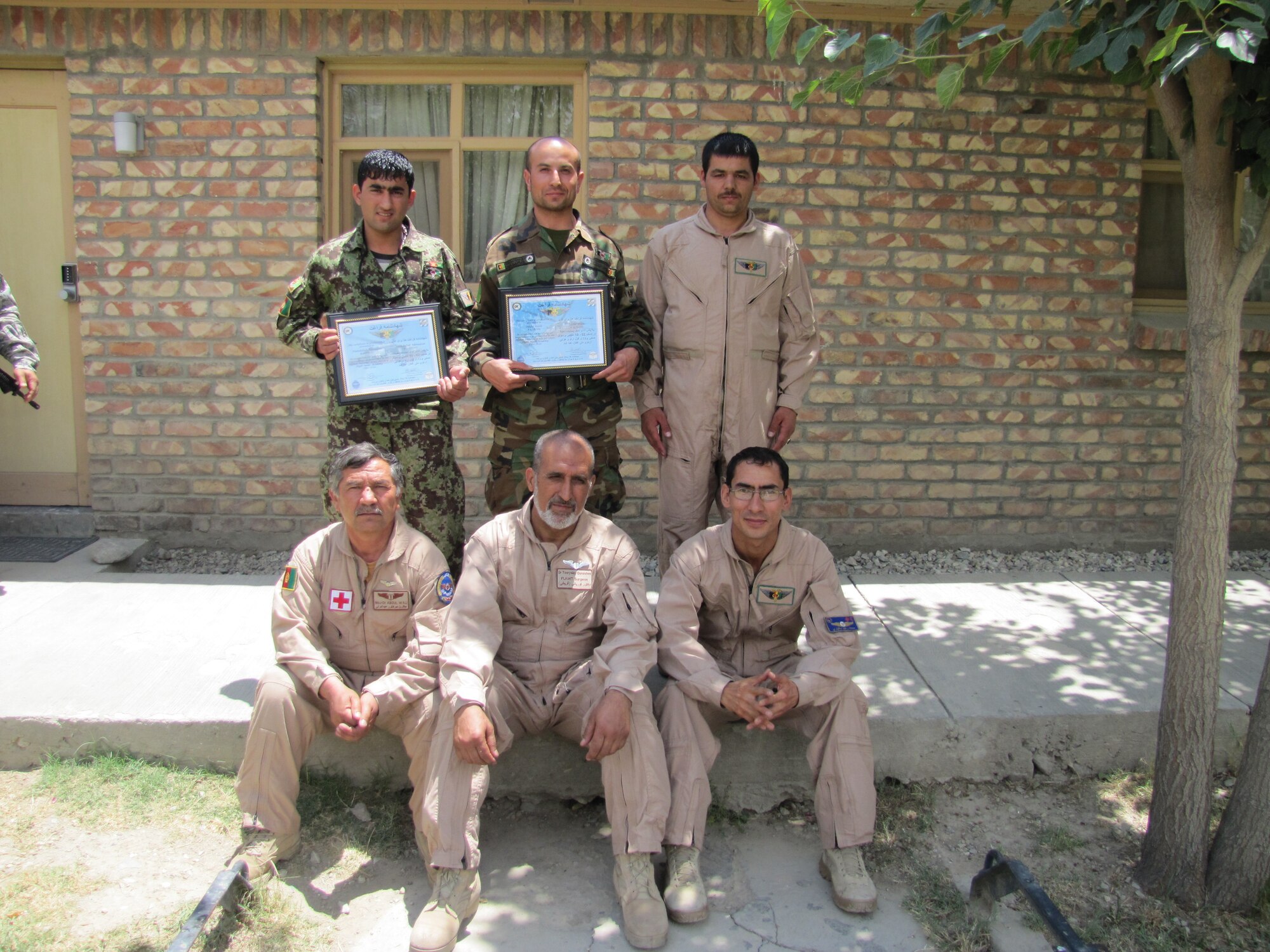 KABUL, Afghanistan - two Afghan Air Force flight medics graduated from the Afghan Air Force Flight Medic Academy at Bagram Air Field on Jul. 6, 2010. (U.S. Navy photo by MC1 Elizabeth Burke/RELEASED).

