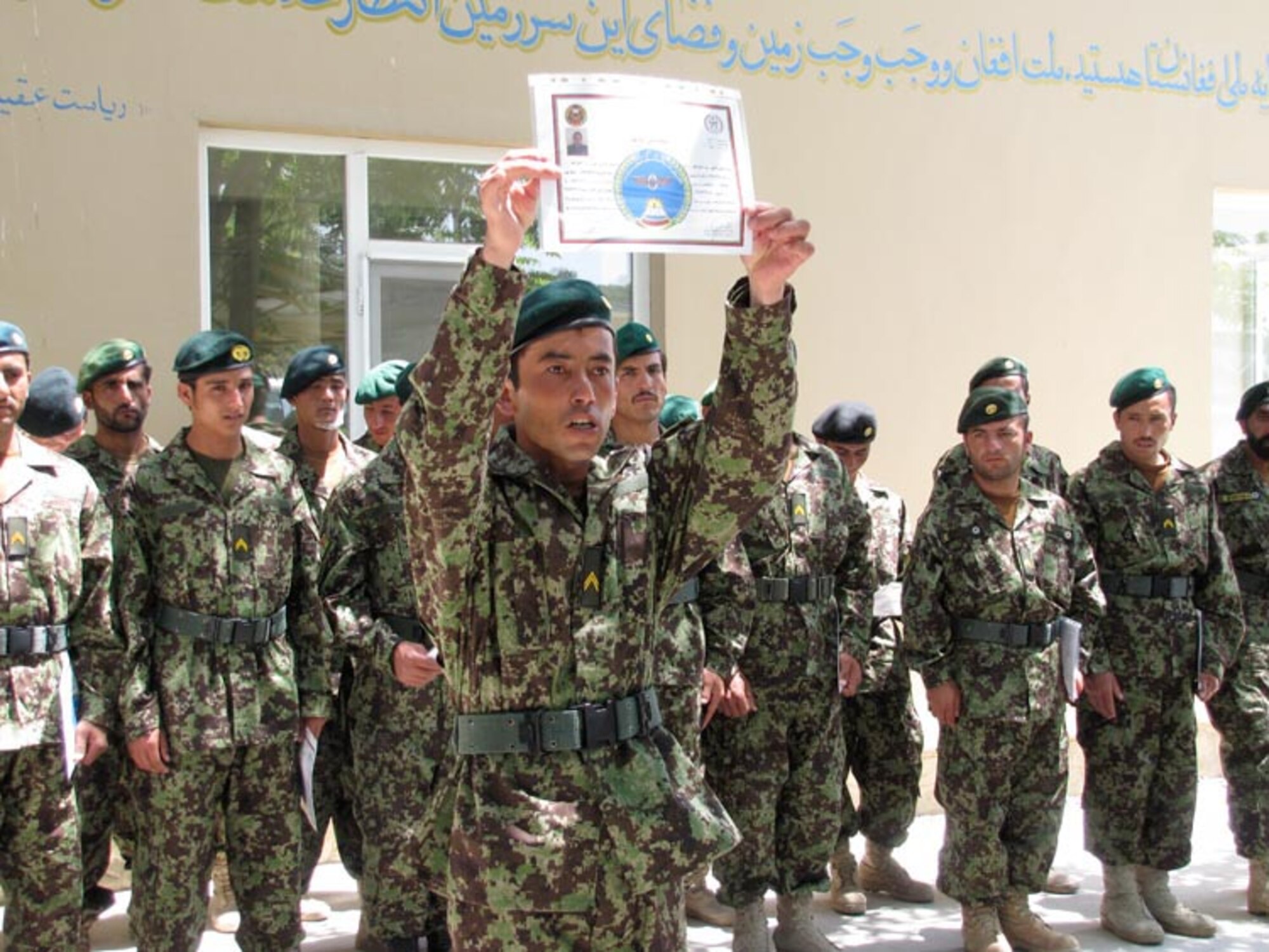 Non-Commissioned Officers graduate from the Team Leader Course of the Afghan Air Force on the Afghan Air Force base in Kabul on Jul. 11, 2010 (U.S. Navy photo by Mass Communications Specialist First Class Elizabeth Burke/RELEASED).