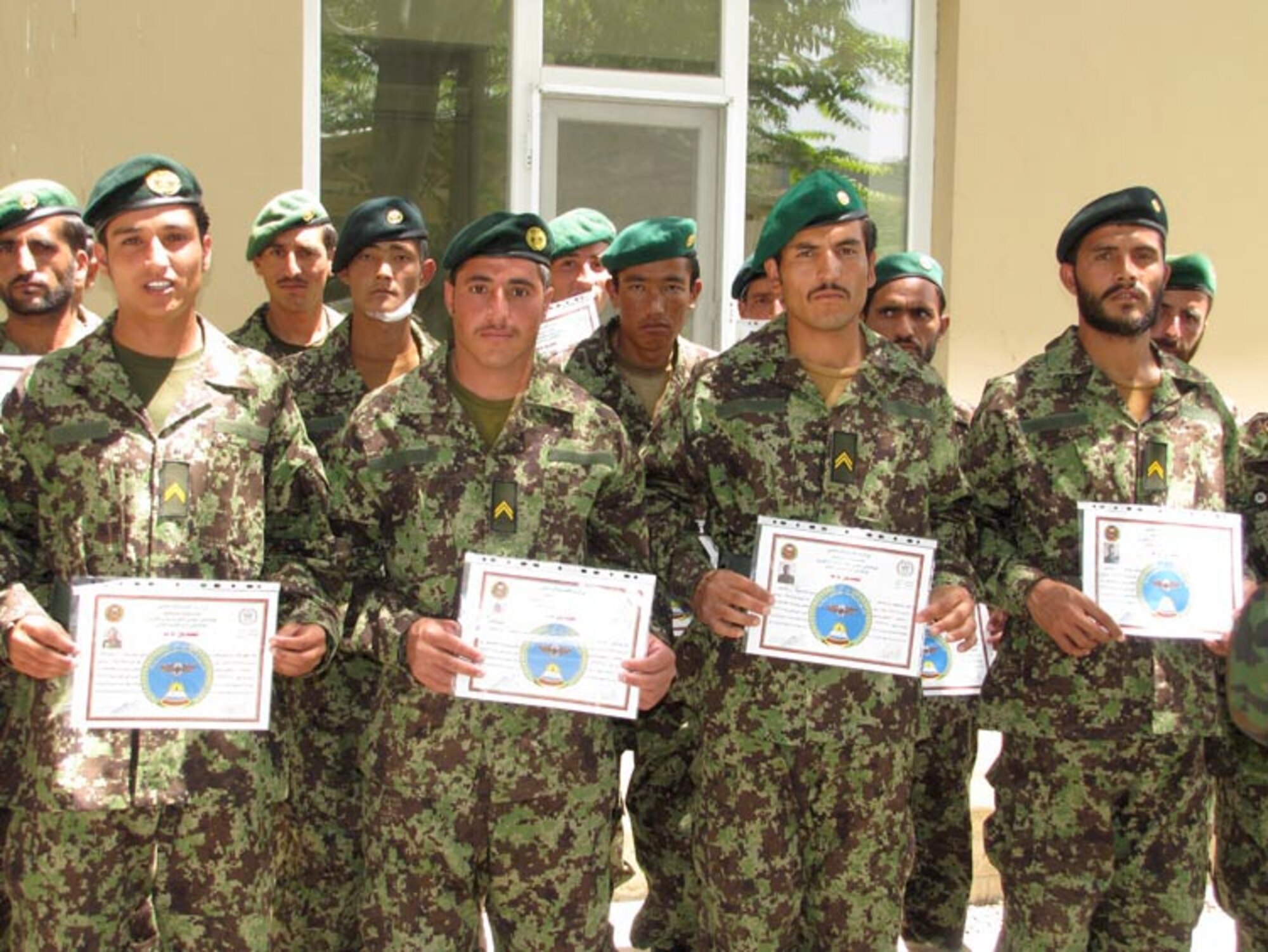 Non-Commissioned Officers graduate from the Team Leader Course of the Afghan Air Force on the Afghan Air Force base in Kabul on Jul. 11, 2010 (U.S. Navy photo by Mass Communications Specialist First Class Elizabeth Burke/RELEASED).
