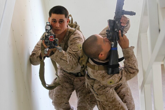 Marines with India Company, 2nd Platoon, 3rd Battalion, 5th Marine Regiment, practice urban operations tactics at the military operations in urban terrain (MOUT) town at Range 220 on Twentynine Palms, Calif., July 11 during Enhanced Mojave Viper. The combined training exercise is aimed at preparing Marines for deployment to Afghanistan in support of Operation Enduring Freedom.