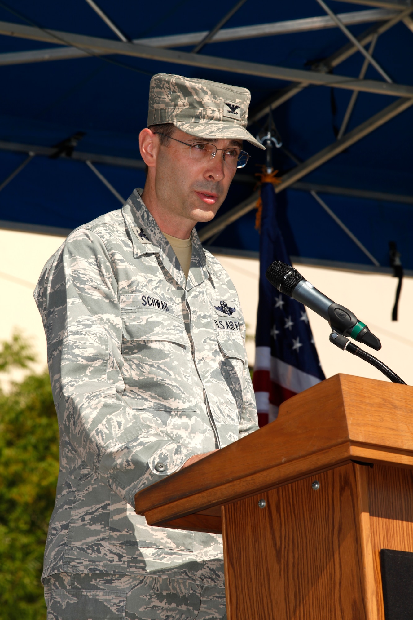 On assumption commander, Col. Gregory E. Schwab addresses the more 450 Airmen and civilians who attended the 95th Air Base Wing change of command ceremony July 9. (Air Force photograph by Stephen K. Robinson)