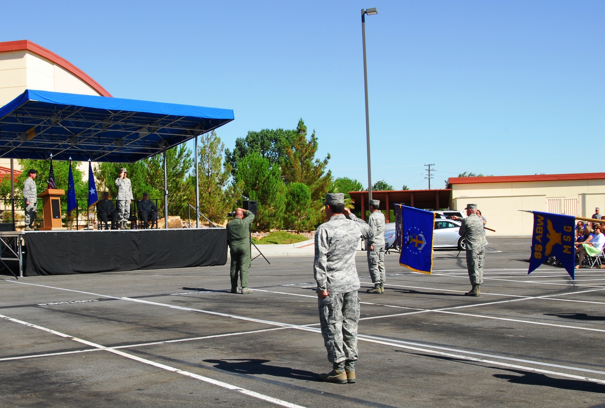 Col. Gregory E. Schwab returns his first salute to the 95th Air Base Wing Airmen in ranks after assuming command July 9.  (Air Force photograph by Stephen K. Robinson)