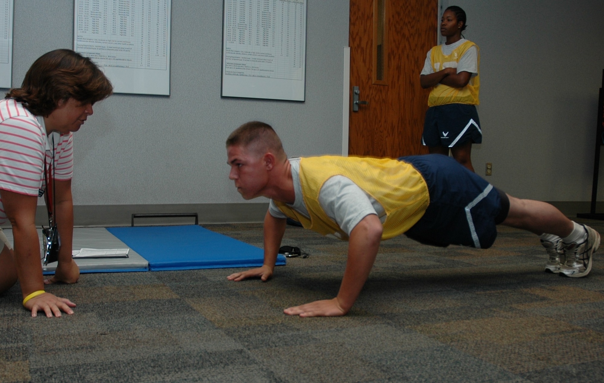 Senior Airman Kenneth M. Childers performs push-ups during his bi-annual physical fitness test July 11, 2010 at the base running track here. With the new standards, the run counts for 60 percent of the test, while body composition counts for 20 percent, followed by push-ups and sit-ups at 10 percent each. Under the old standards the run counted for 50 percent, the body composition counted for 30 percent with the push-ups and sit-ups remaining the same. Senior Airman Childers is a pavements and construction equipment operator with the 560th Red Horse Squadron here. (U.S. Air Force photo/Staff Sgt. Shane Ellis)