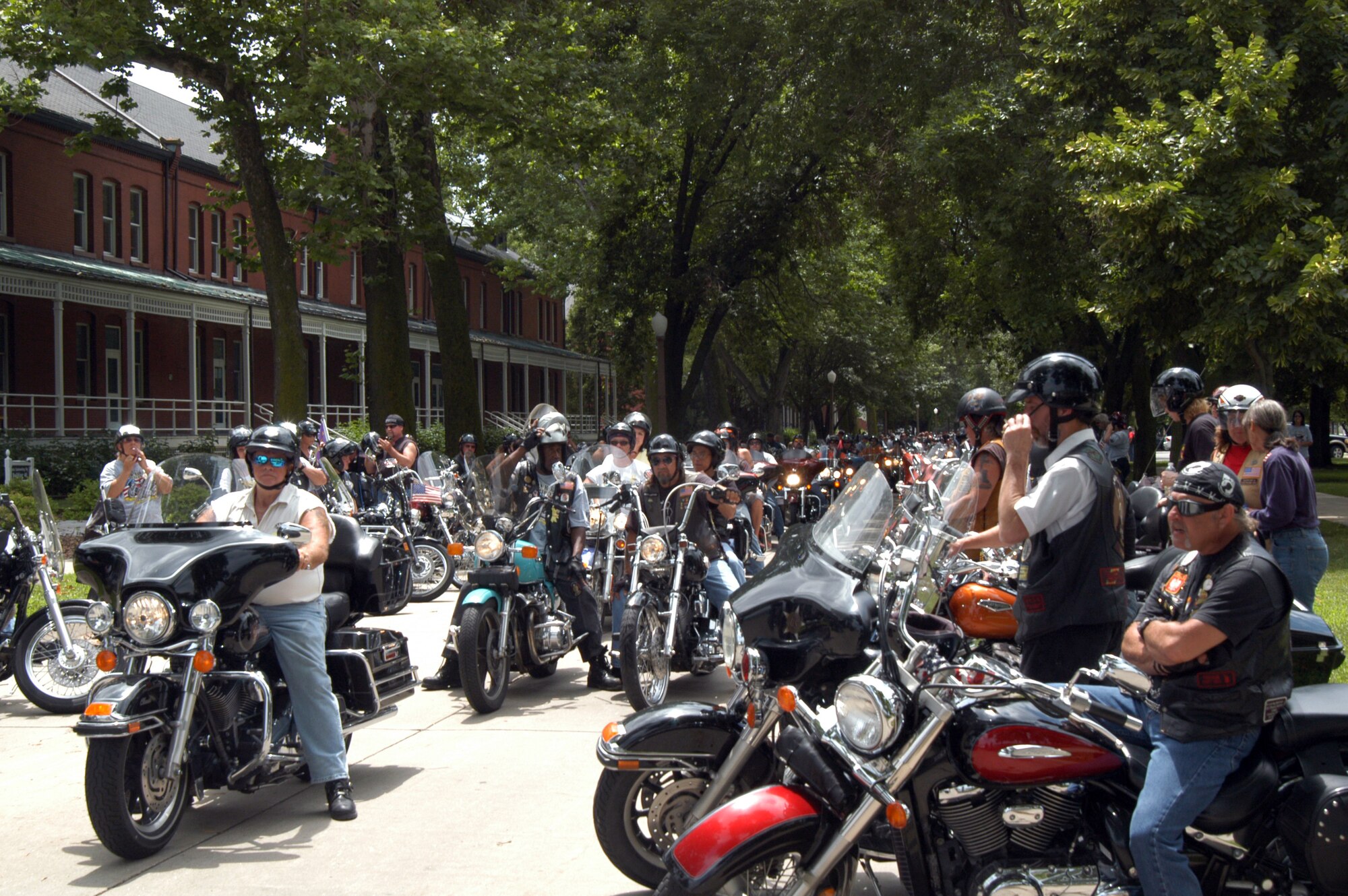 OFFUTT AIR FORCE BASE, Neb. - Motorcycle riders prepare to leave the base parade grounds during the 8th Annual Yellow Ribbon Run July 11. The brief stopover gave the more than 450 motorcyclists a chance to refresh themselves with cookies and water provided by the spouses of General's Row. U.S. Air Force photo by Airman 1st Class Peter R.O. Danielson 
                                