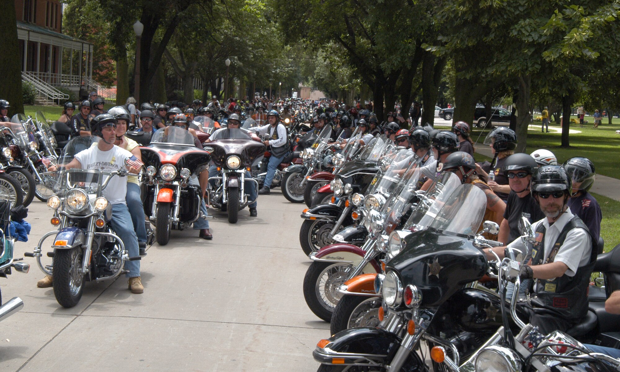 OFFUTT AIR FORCE BASE, Neb. - Motorcycle riders prepare to leave the base parade grounds during the 8th Annual Yellow Ribbon Run July 11. The brief stopover gave the more than  motorcyclists a chance to refresh themselves with cookies and water provided by the spouses of General's Row. U.S. Air Force photo by Airman 1st Class Peter R.O. Danielson 
                                