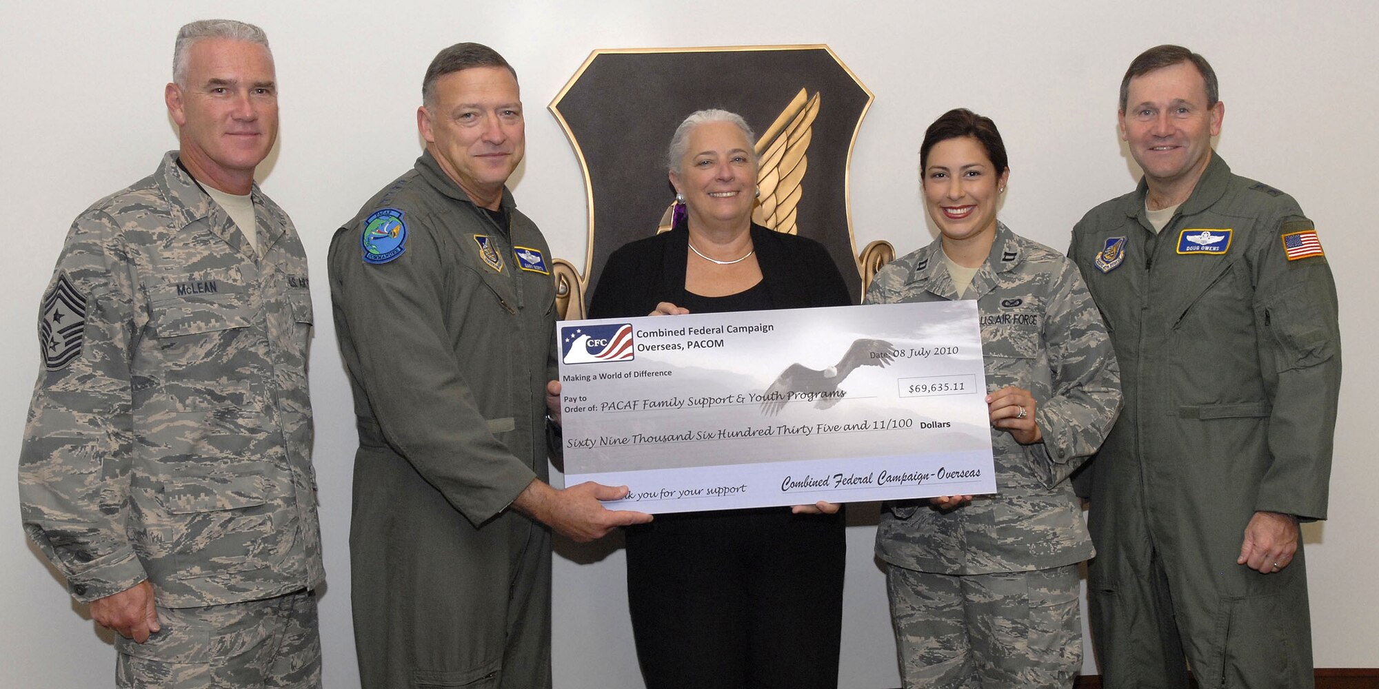 (From left to right) Pacific Air Forces Command Chief Brooke McLean, Pacific Air Forces Commander General Gary North, Combined Federal Campaign oversea representative Mrs. Renee Acosta, 13th Air Forces, Captain Genieve David and Pacific Air Forces, Vice Commander, Major General Doug Owens, pose with a check presented to General Gary North from Mrs. Acosta on behalf of CFC, at the Kenney Conference Center, Headquarters Pacific Air Forces, Joint Base Pearl Harbor Hickam, Hawaii, July 8, 2010.  Pacific Air Forces worldwide donated $1.3 million dollars to the CFC this year.  Mrs.  Acosta presented a check to Pacific Air Forces for $69, 635.11 to help support the PACAF Family Support and Youth Programs.  (U.S. Air Force photo/Tech. Sgt. Jerome S. Tayborn)