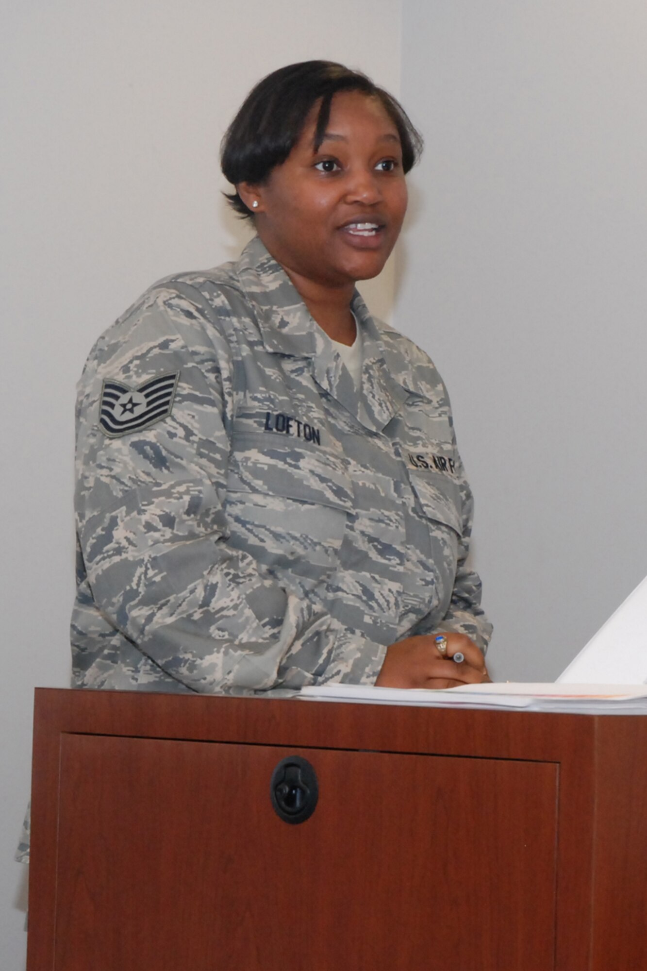 Tech. Sgt. Tanisha R. Lofton, president, Dobbins 56 Group, conducts the monthly meeting during the Unit Training Assembly July 11.at the Transportation Proficiency Center.  (U.S. Air Force photo/Master Sgt. James Branch)