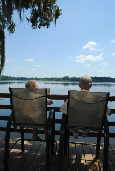 VALDOSTA, Ga. -- Retired Tech. Sgt. Fred Blake and his wife Marge, who said they have been going to Grassy Pond for years, relax on the deck here July 8. Along with fishing and boating on the pond, a three-mile nature hiking trail is available to visitors. (U.S. Air Force photo by Master Sgt. Stan Coleman/RELEASED)
